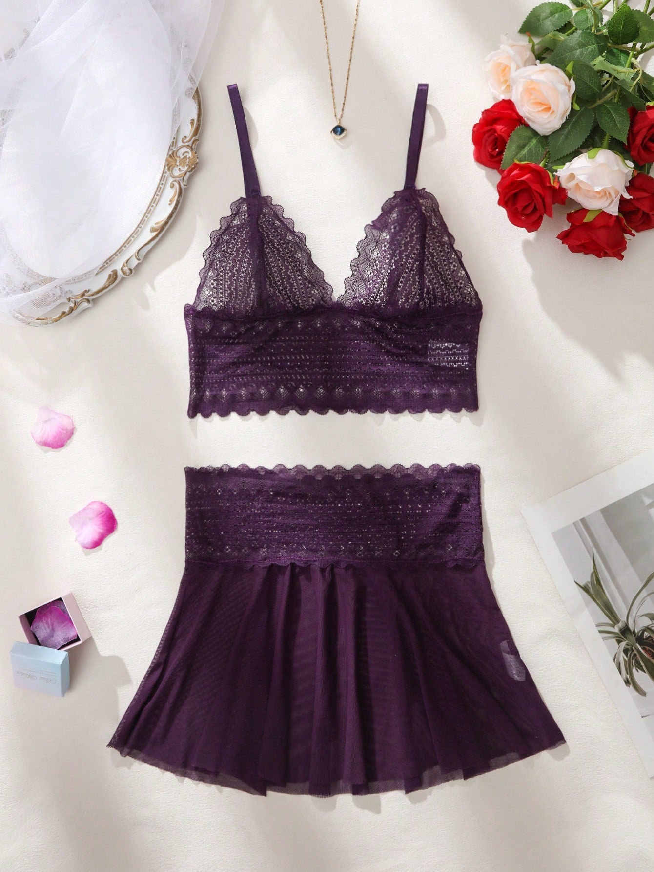 Women’s 2-piece lingerie set featuring a lace and mesh slip dress with spaghetti straps and matching boyshorts. Wireless bralette style with scalloped contrast lace and semi-sheer mesh details.