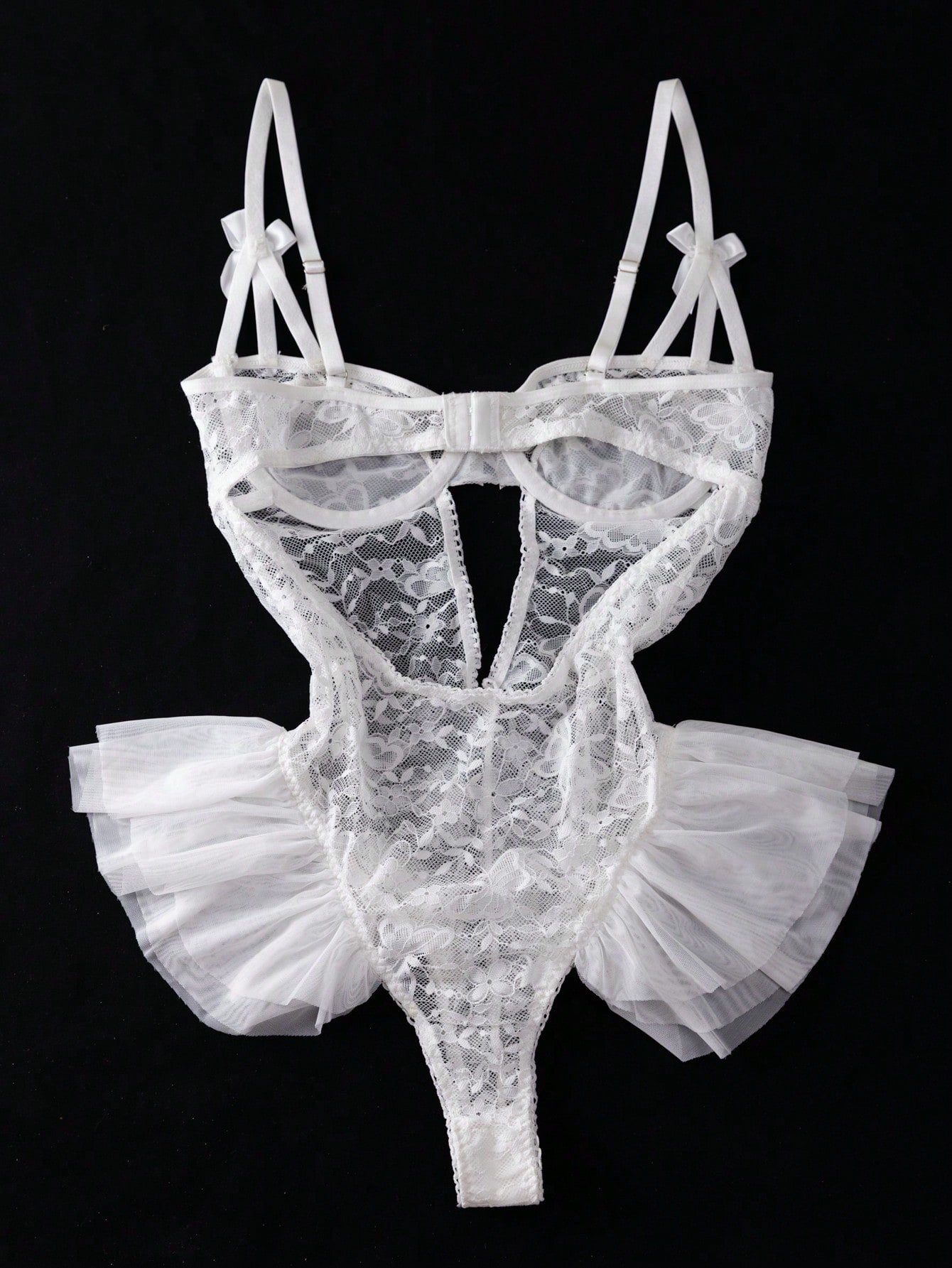 Women’s butterfly lace and mesh lingerie jumpsuit with ruffled trim, underwire cups, bow detail, cut-out accents, sheer fabric, and adjustable spaghetti straps.