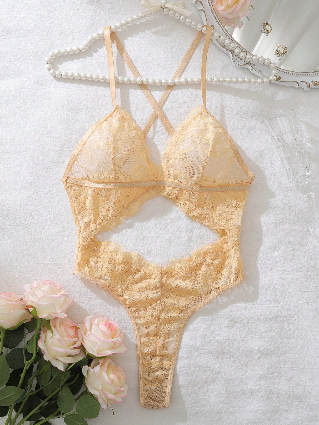 Dark green women’s lace teddy bodysuit set featuring spaghetti straps, backless criss-cross detailing, cut-out accents, and a thong-style high-rise bottom; semi-sheer lace with adjustable straps and wireless bralette support.