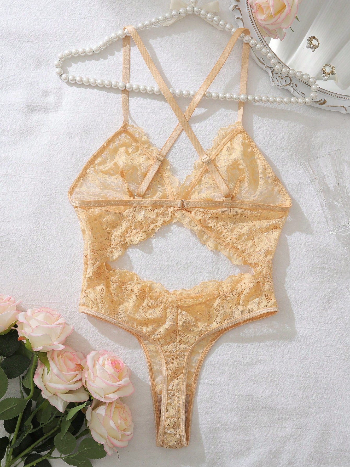 Dark green women’s lace teddy bodysuit set featuring spaghetti straps, backless criss-cross detailing, cut-out accents, and a thong-style high-rise bottom; semi-sheer lace with adjustable straps and wireless bralette support.