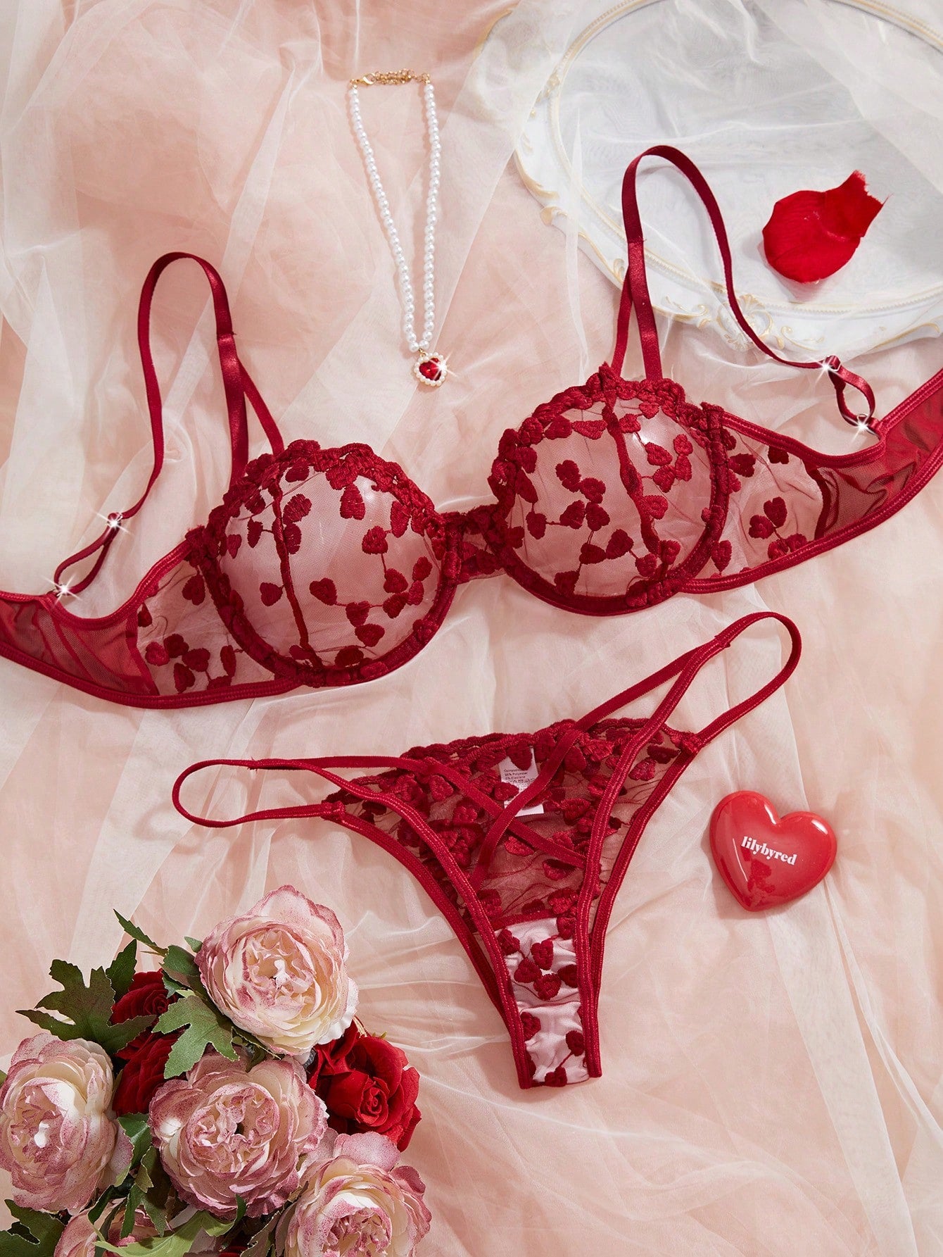 Burgundy women’s 2-piece lingerie set with heart mesh splice details, embroidery, sheer cut-out design, underwire demi bra with adjustable spaghetti straps, and matching mid-rise thong.