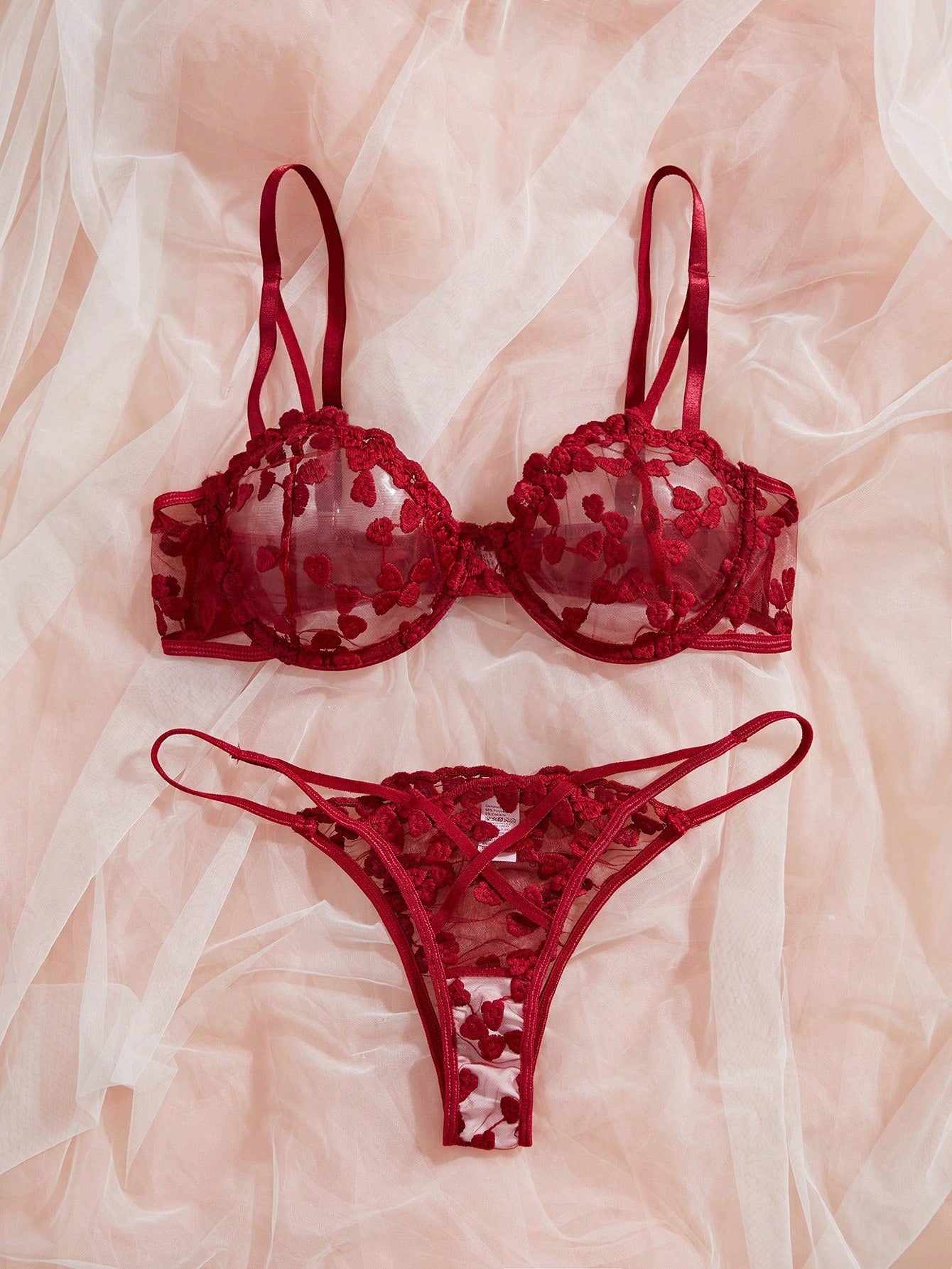 Burgundy women’s 2-piece lingerie set with heart mesh splice details, embroidery, sheer cut-out design, underwire demi bra with adjustable spaghetti straps, and matching mid-rise thong.