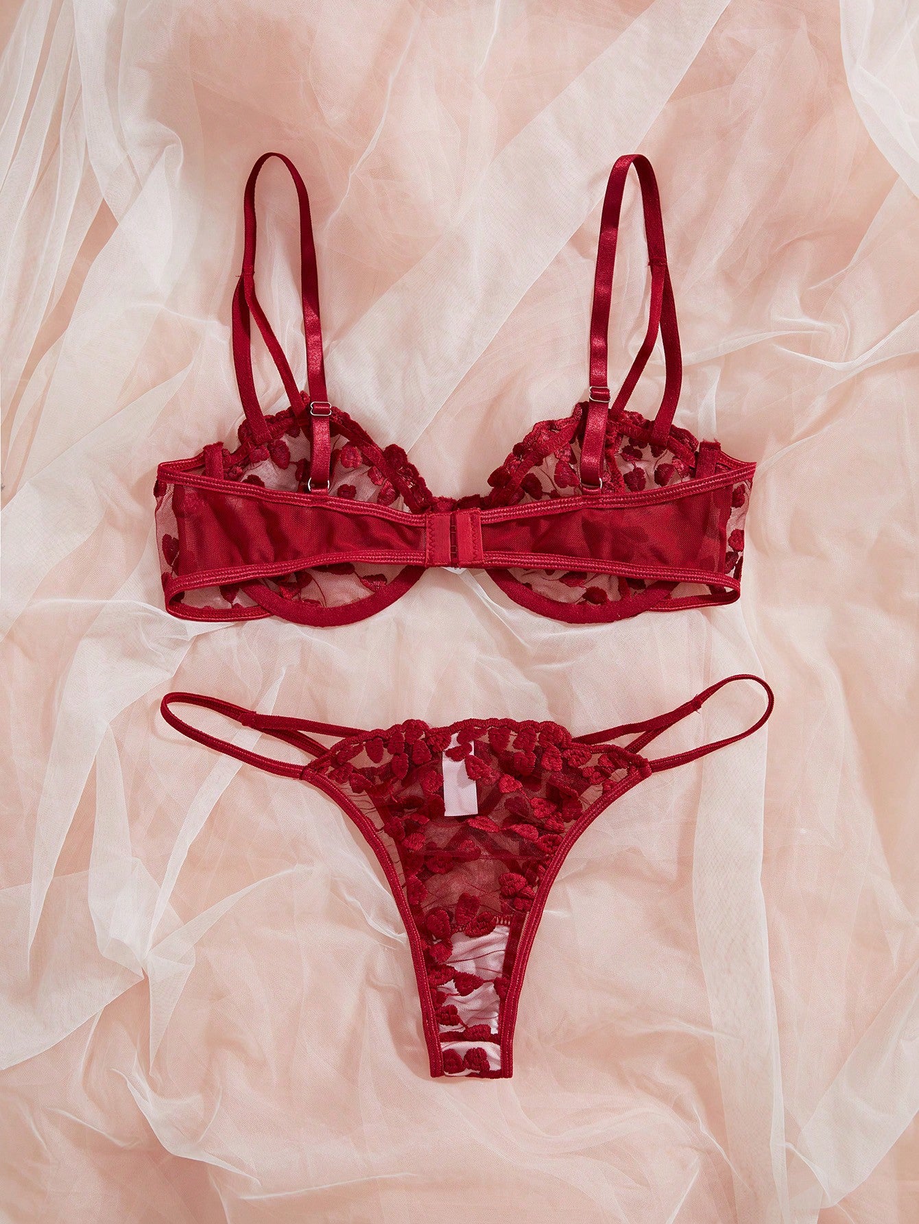 Burgundy women’s 2-piece lingerie set with heart mesh splice details, embroidery, sheer cut-out design, underwire demi bra with adjustable spaghetti straps, and matching mid-rise thong.