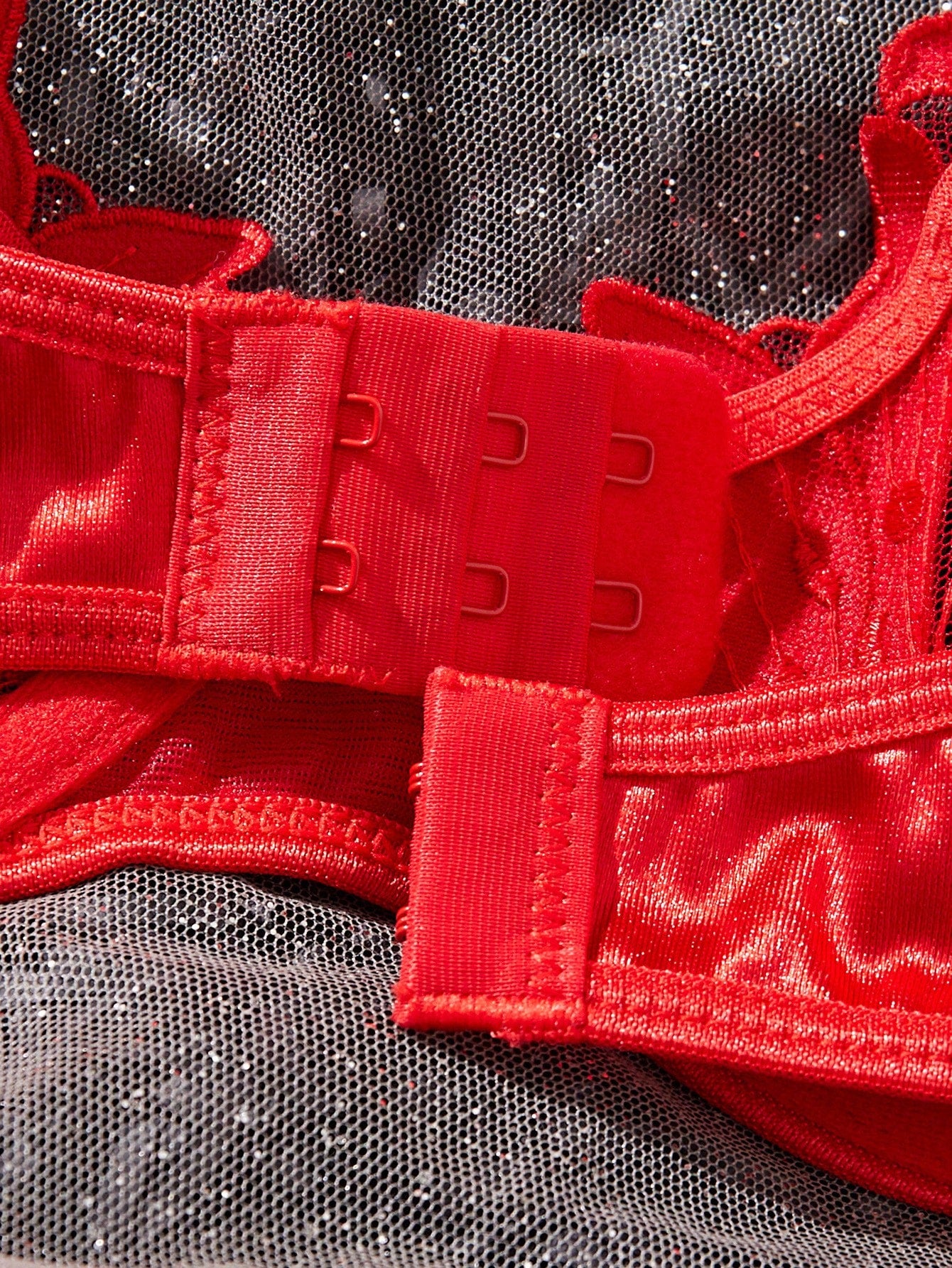 Women’s 2-piece sexy lingerie set featuring an embroidered sheer mesh demi bra with adjustable spaghetti straps and a matching low-rise thong.
