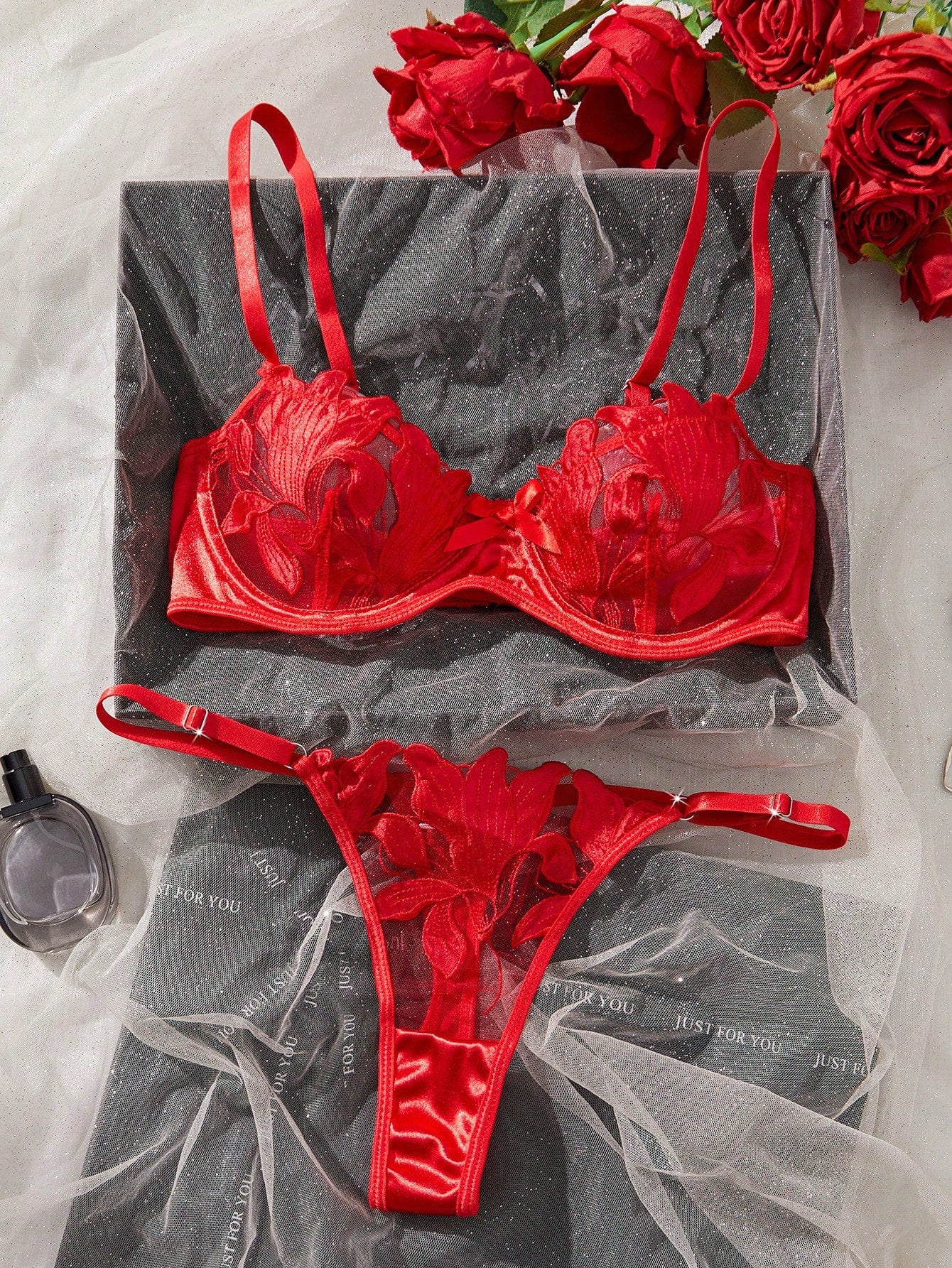 Women’s 2-piece sexy lingerie set featuring an embroidered sheer mesh demi bra with adjustable spaghetti straps and a matching low-rise thong.