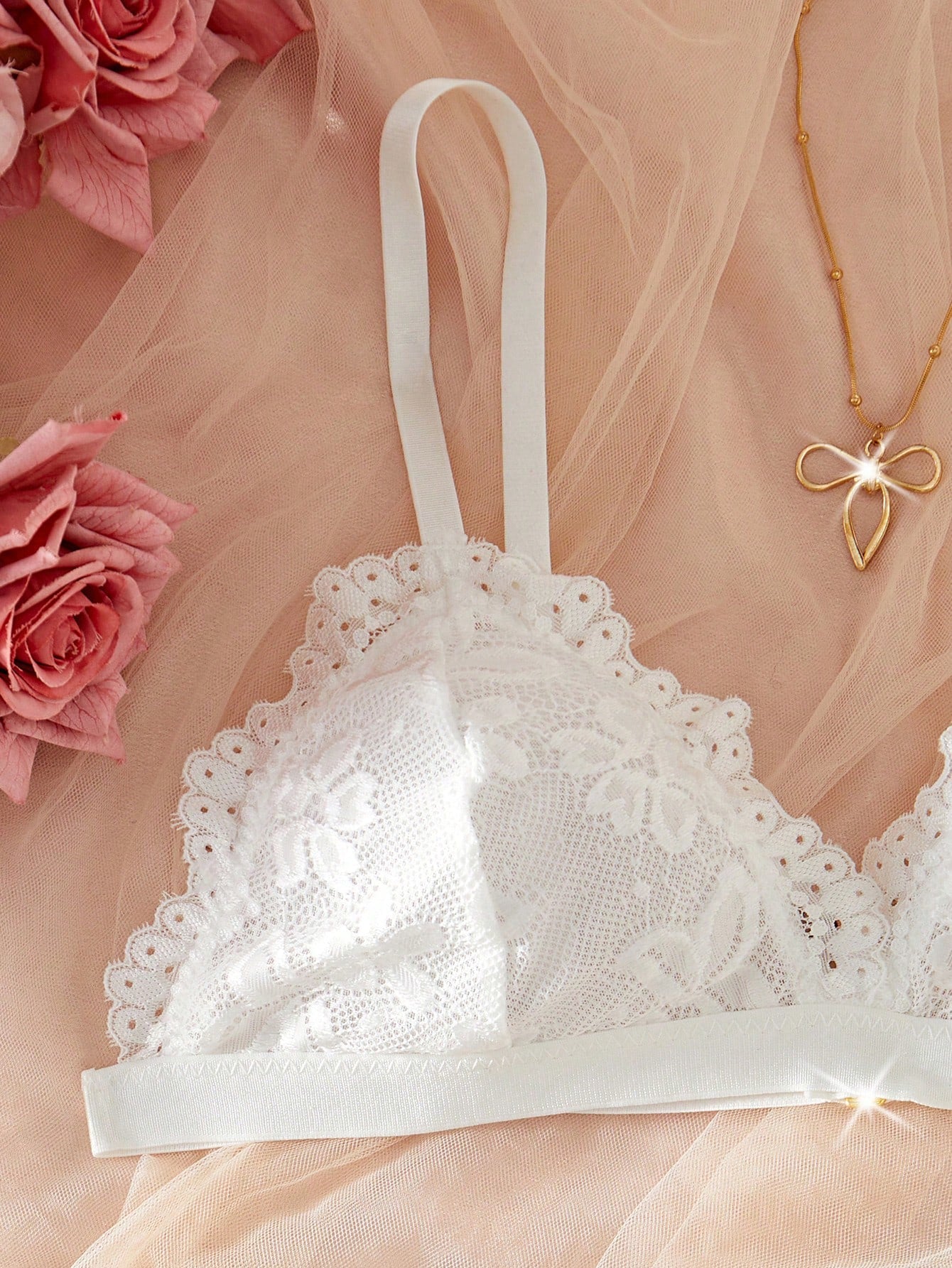 Women's 2-piece lingerie set with a solid color lace patchwork cami bralette featuring spaghetti straps and a crossback design, paired with a matching low-rise thong panty.