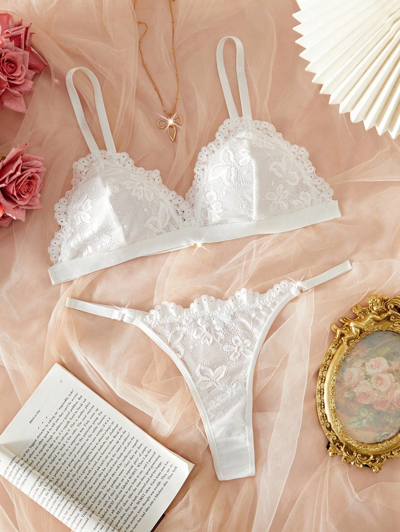 Women's 2-piece lingerie set with a solid color lace patchwork cami bralette featuring spaghetti straps and a crossback design, paired with a matching low-rise thong panty.