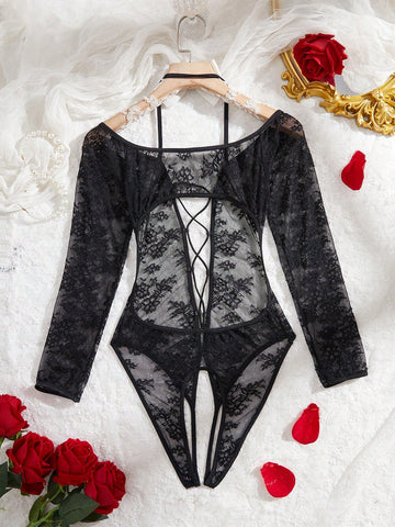 Elegant lace crotchless bodysuit with a backless lace-up design, adjustable spaghetti straps, and a V-string style bottom.