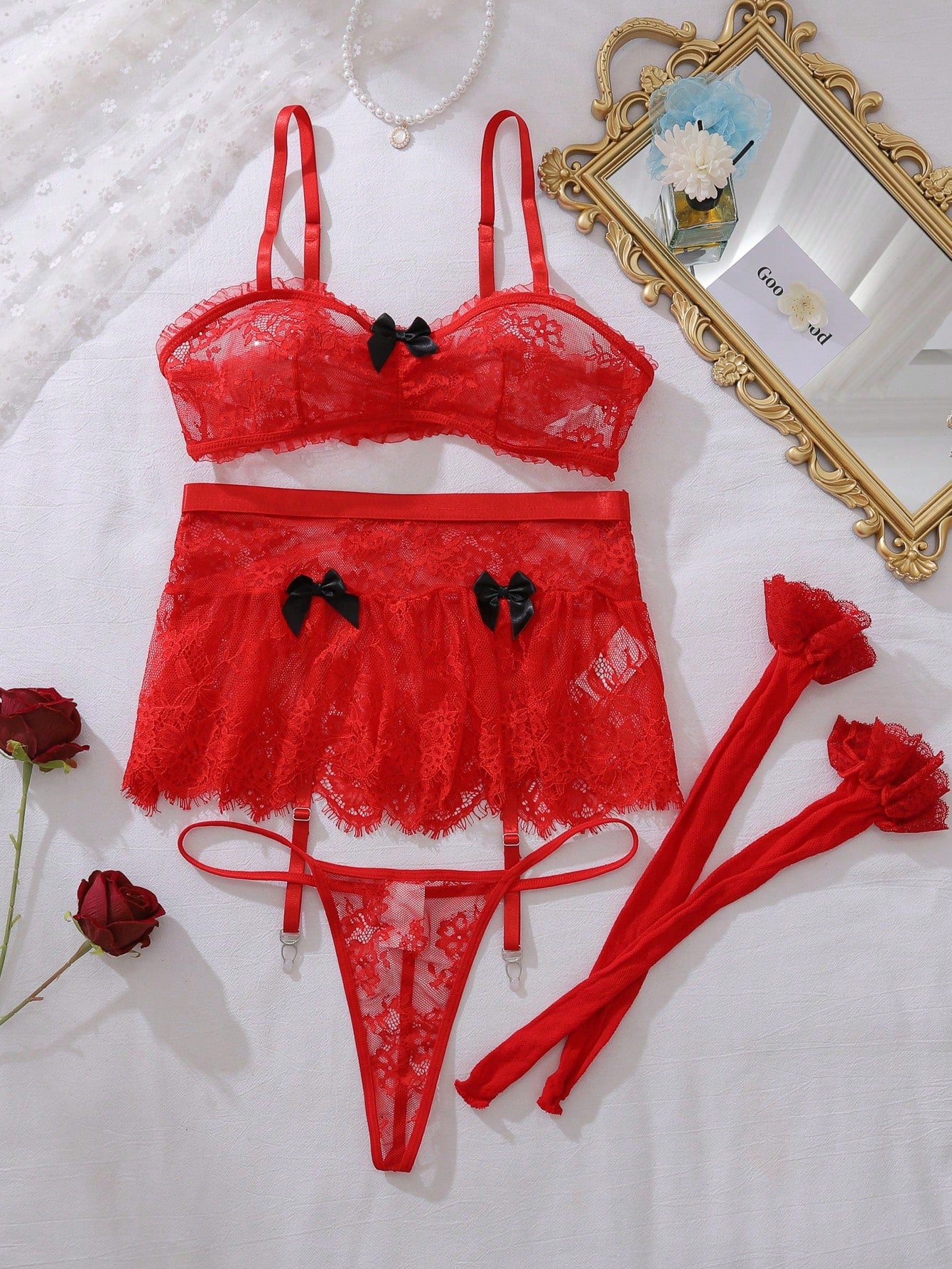 Women’s 5-piece romantic lace lingerie set featuring a sheer bralette with adjustable spaghetti straps, mini skirt, thong, and stockings with contrast lace and bow details.