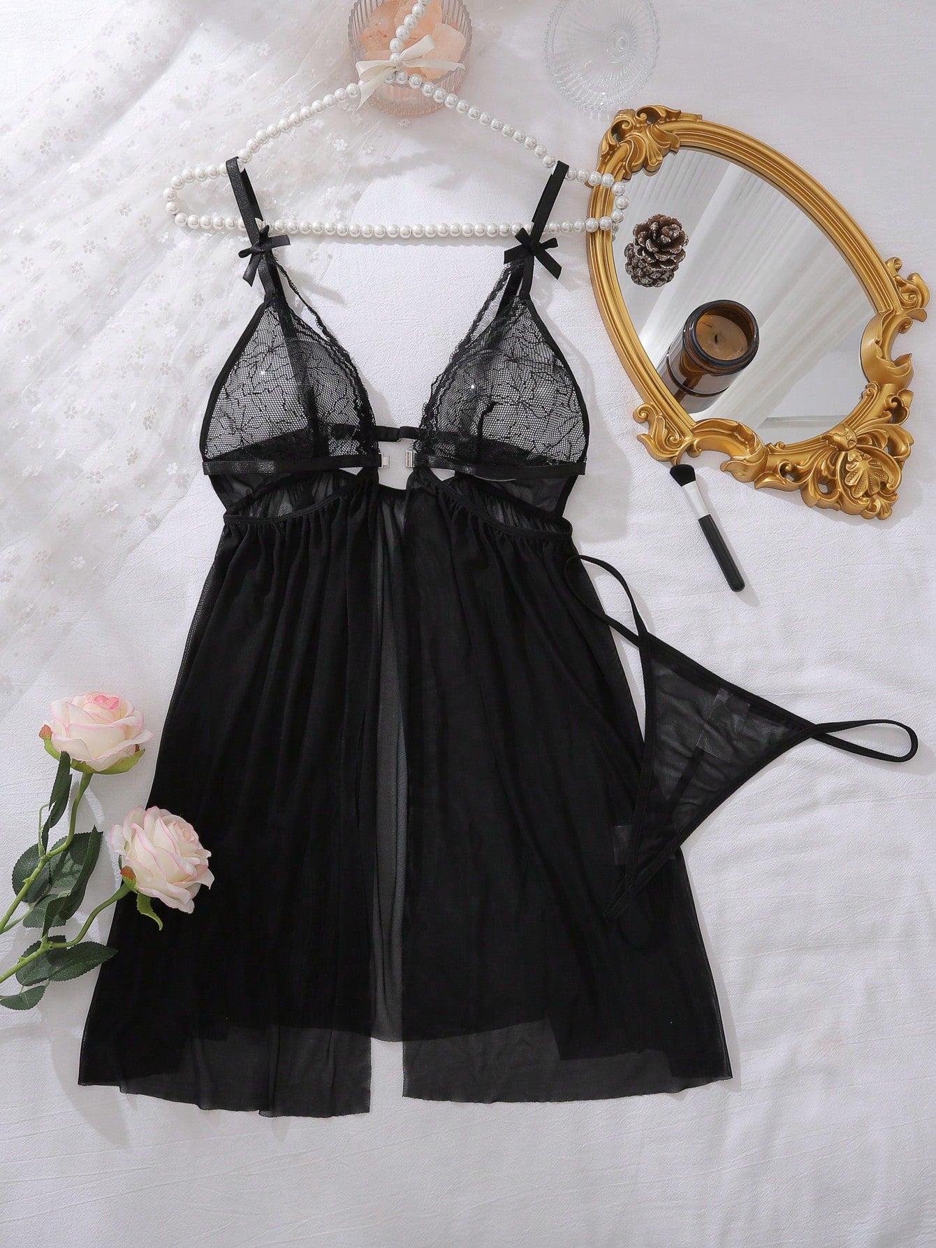 Women’s 2-piece lingerie set featuring a romantic lace patchwork babydoll nightgown with spaghetti straps, bow and cut-out details, and a matching low-rise thong.