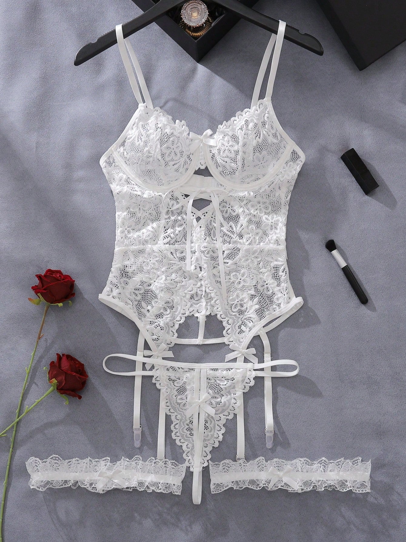 Floral lace underwire garter corset lingerie set with adjustable spaghetti straps, backless bra, V-string panty, and one pair of leg rings.