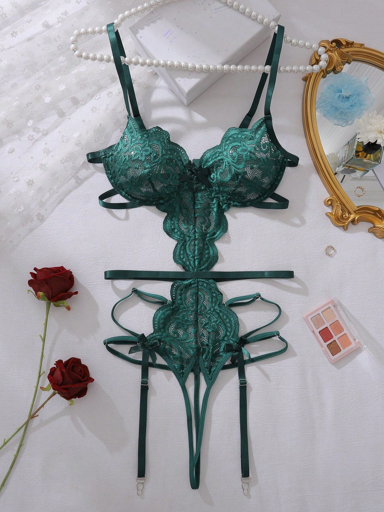Dark green floral lace backless teddy bodysuit lingerie with sheer unlined fabric, scalloped trim, cut-out details, adjustable spaghetti straps, triangle cups, wireless bralette style, high-rise V-string design, and removable padding.