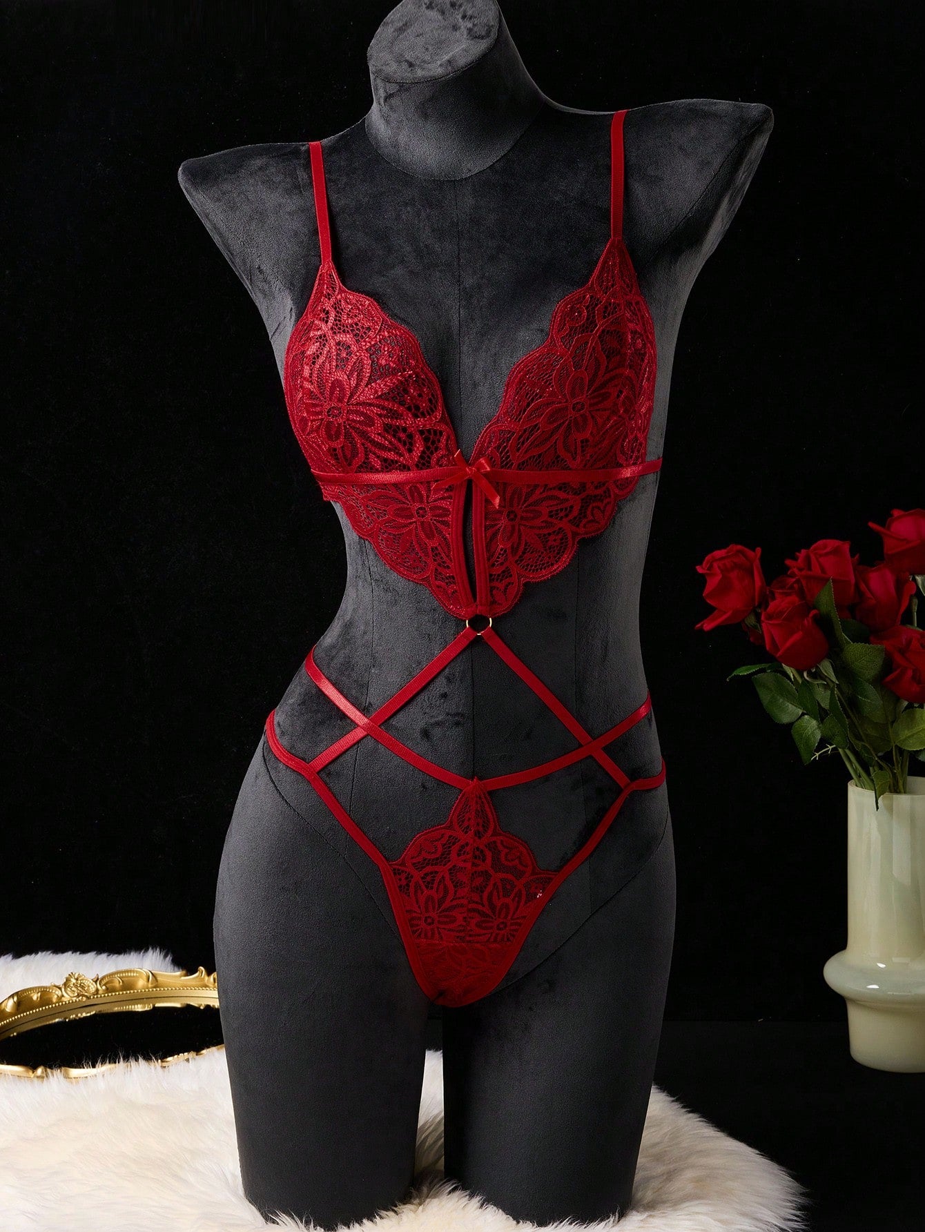 Women’s classic sexy lace bodysuit with cut-out detail, V-neckline, adjustable spaghetti straps, wireless bralette, thong-style bottom, and semi-sheer fabric.