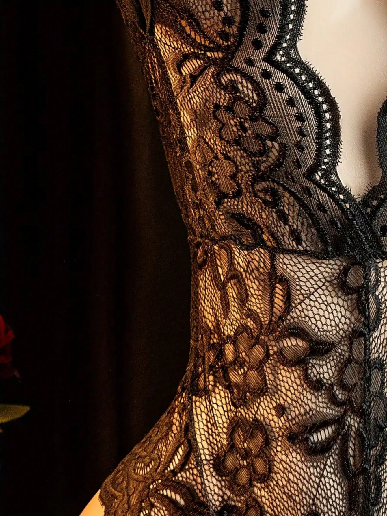Women's sexy bodysuit with crotchless, hollow-out design, featuring contrast lace and mesh, spaghetti straps, crossback detail, plunge wireless shape, and semi-sheer fabric.