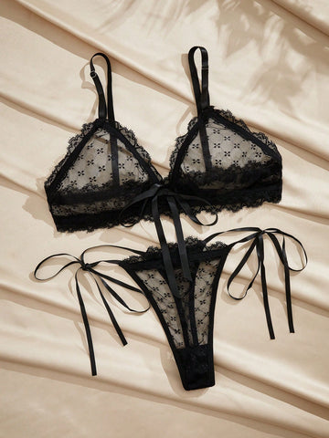 French minimalist 2-piece lingerie set with a sheer wireless bralette featuring contrast lace trim and knot detail, plus a matching mid-rise thong with medium-stretch fabric and adjustable straps.