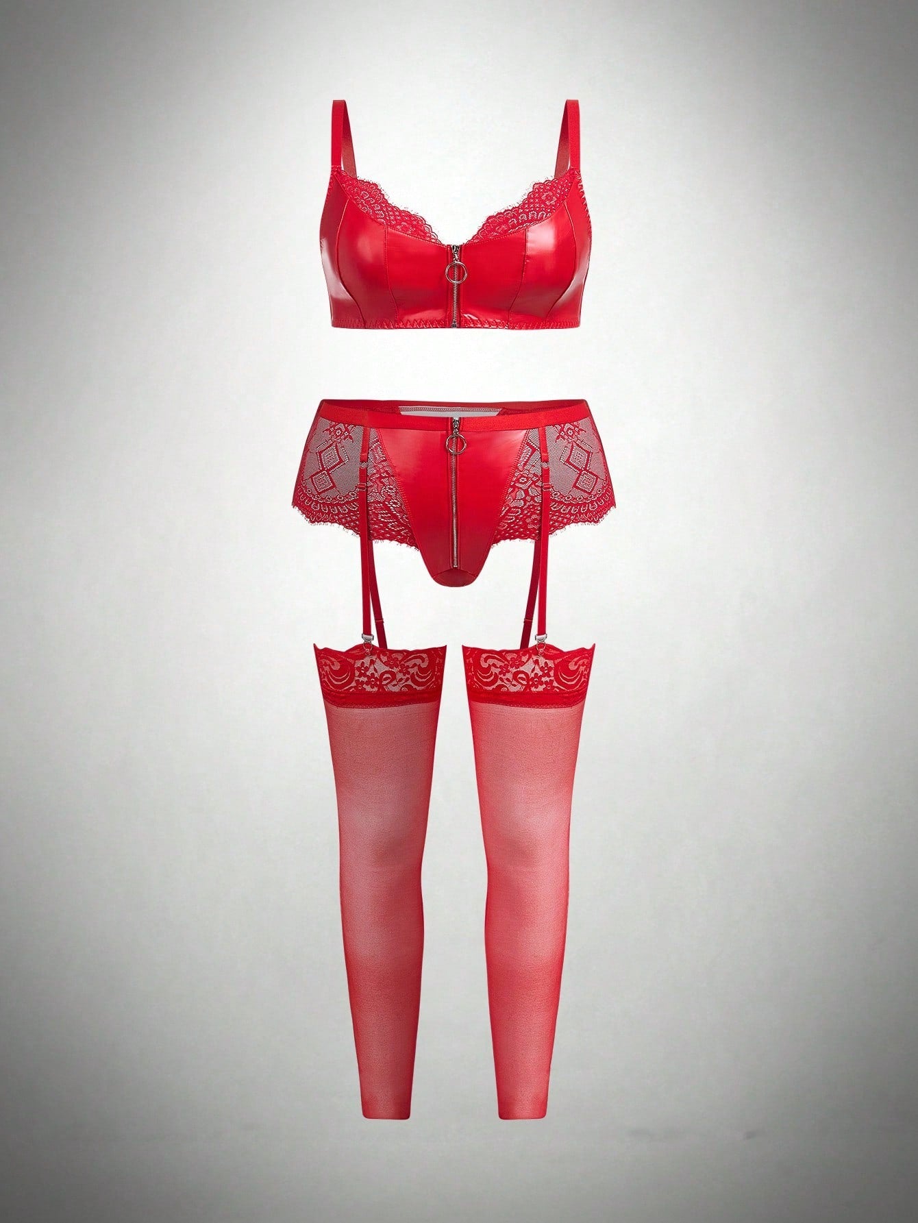 Three-piece lingerie set featuring a wireless spaghetti-strap bra with zipper and contrast lace splice details, a high-rise thong panty, and matching stockings in a punk-inspired style.