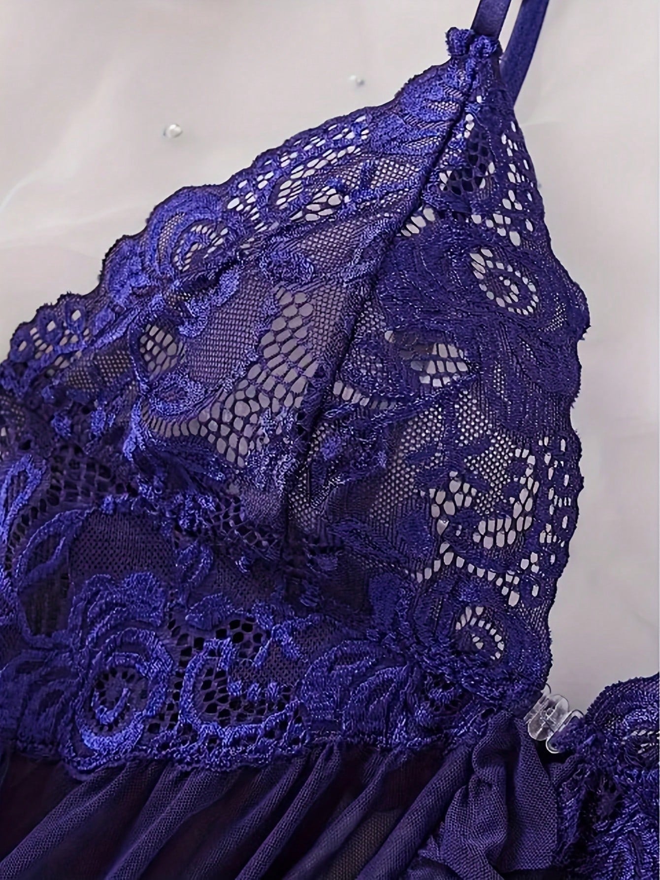 Women's 2-piece sexy lingerie set featuring a deep V sheer contrast lace babydoll bra with adjustable spaghetti straps and matching low-rise briefs; wireless plunge style with short sleeveless romantic design.