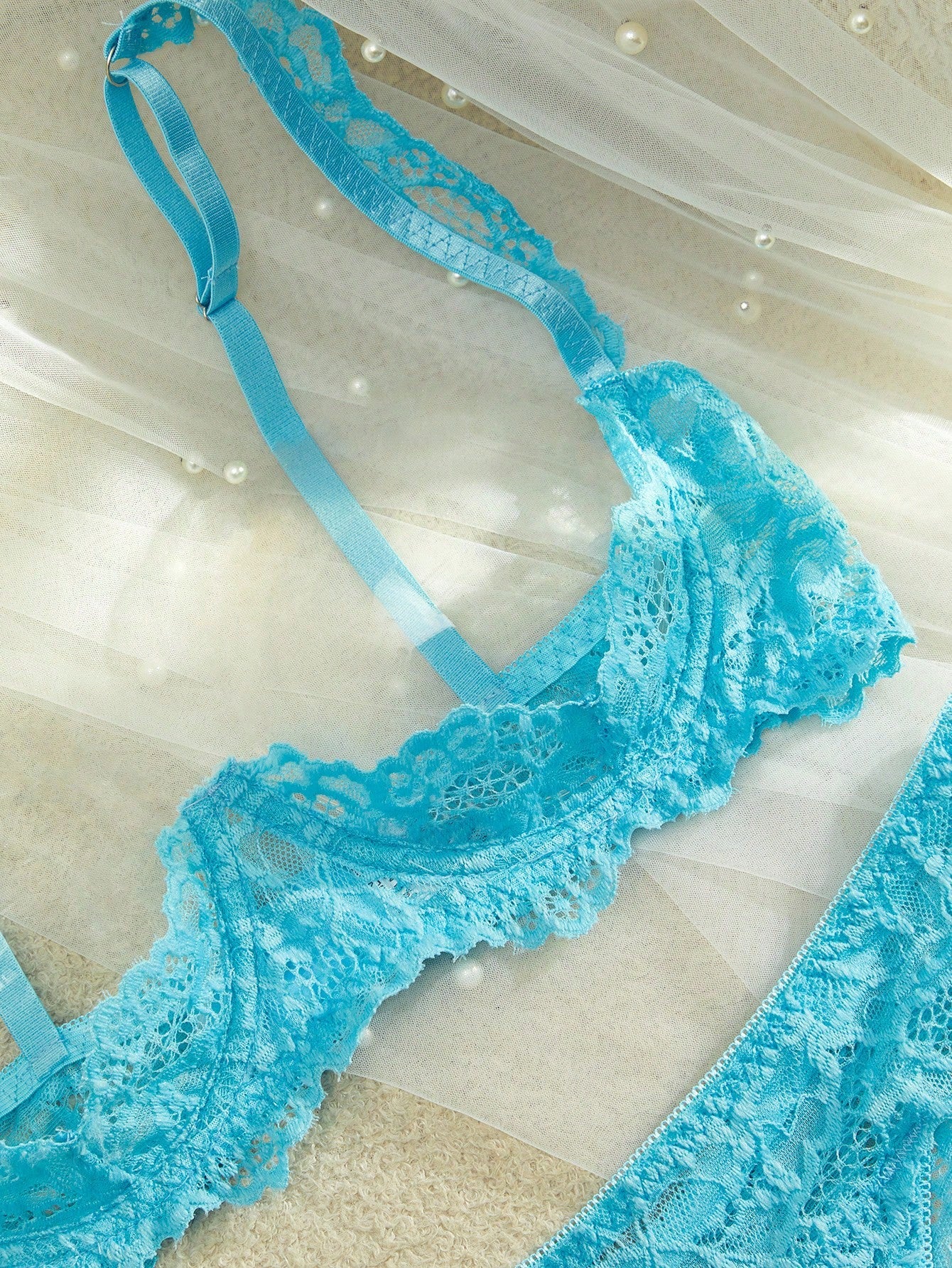 Women’s 2-piece contrast lace lingerie set with a sheer plain design, featuring an underwire open-cup bra with adjustable spaghetti straps and matching low-rise V-string panties.