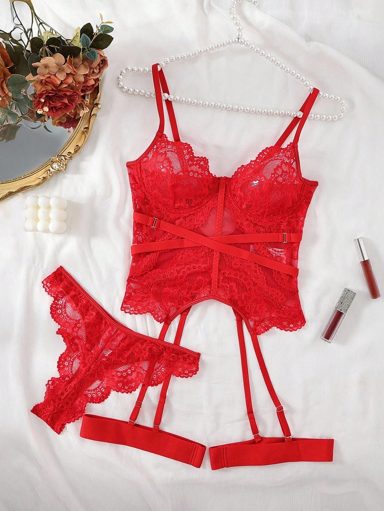 Women’s 4-piece lace lingerie set featuring a longline underwire bra with adjustable spaghetti straps, matching low-rise thong panties, and decorative ribbon details with cutout accents.