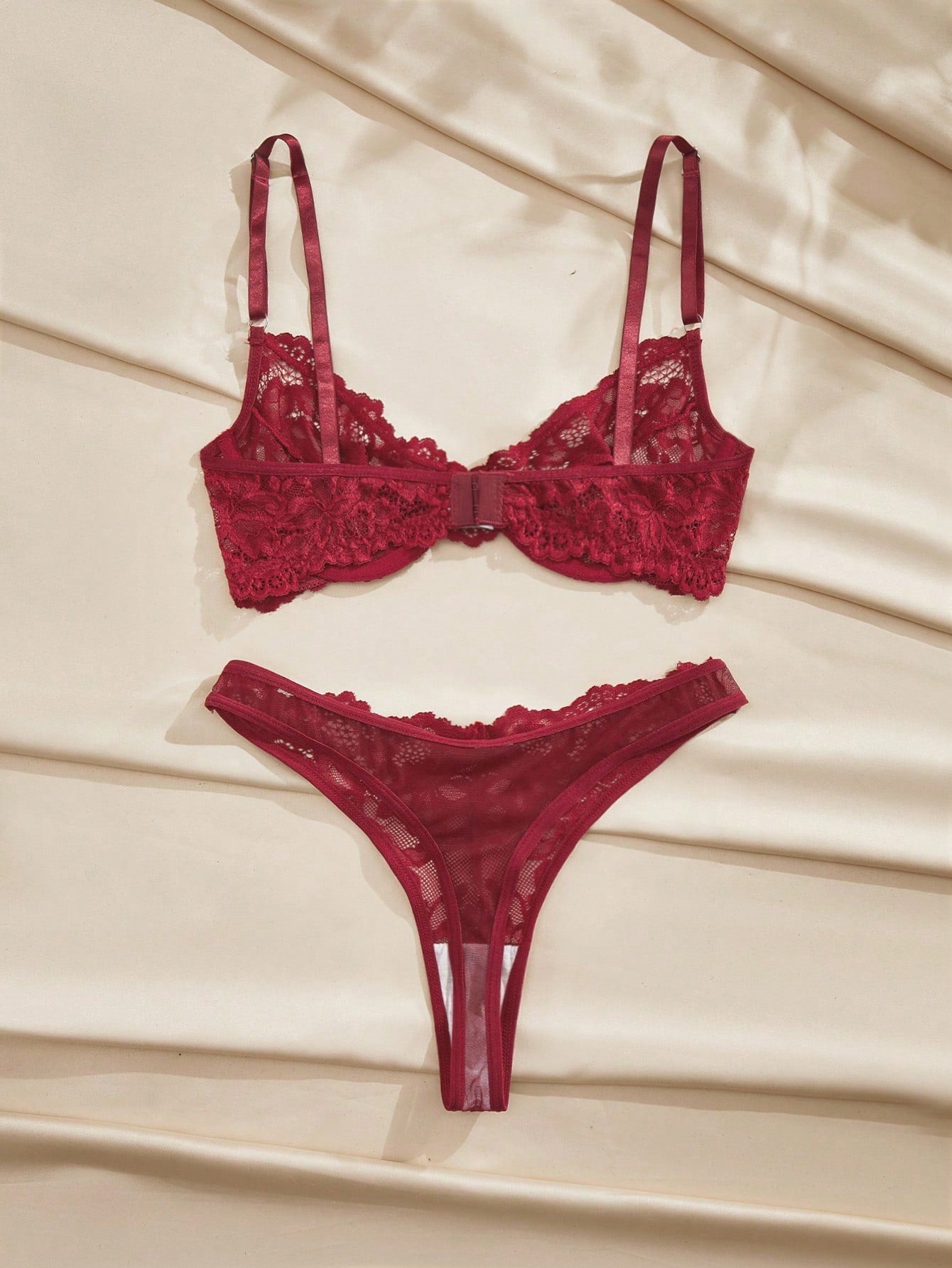 Burgundy floral lace underwire lingerie set with adjustable spaghetti straps, demi bra, and matching mid-rise thong