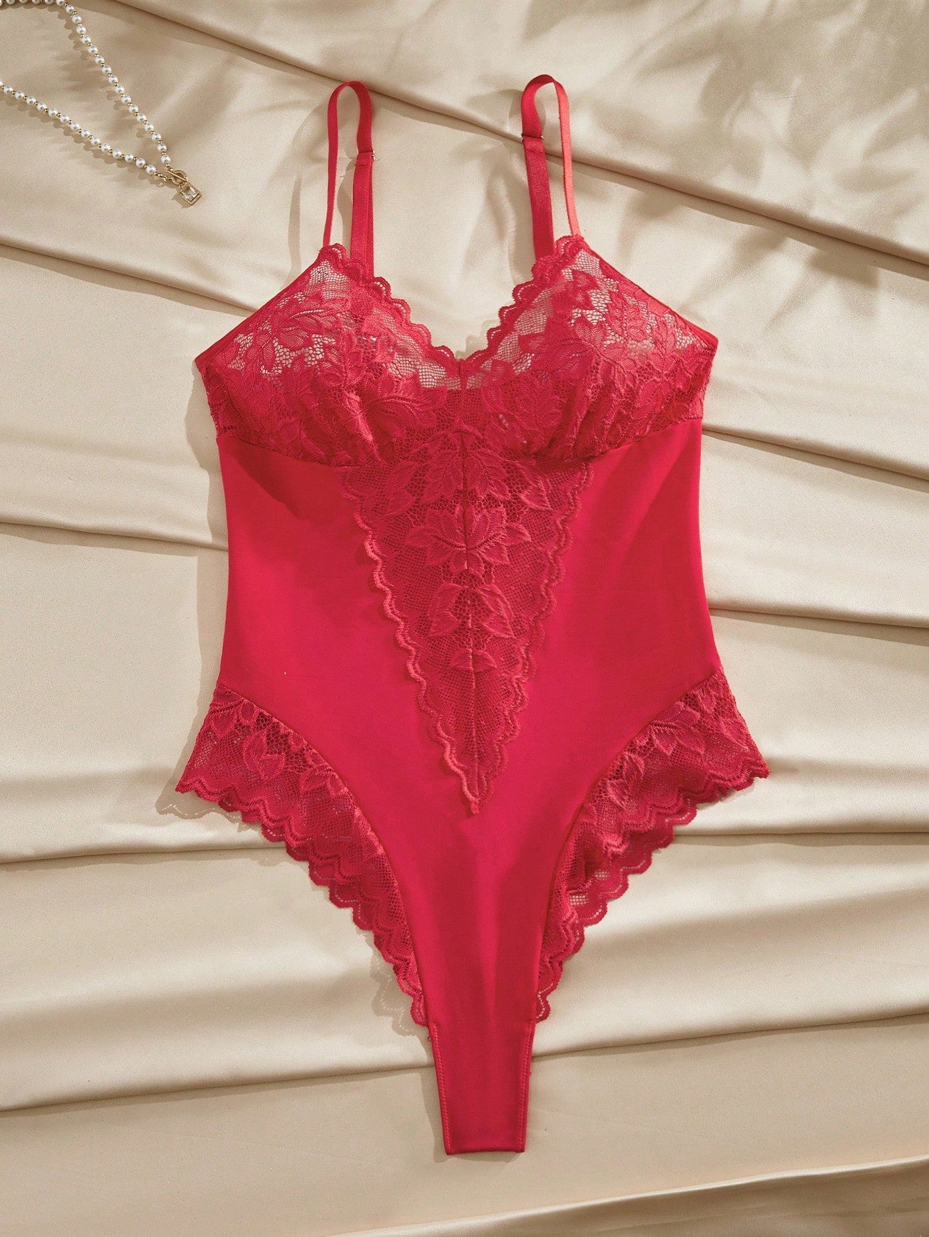 Women’s wireless floral lace sheer backless bodysuit with adjustable spaghetti straps, triangle cups, and brief-cut bottom.