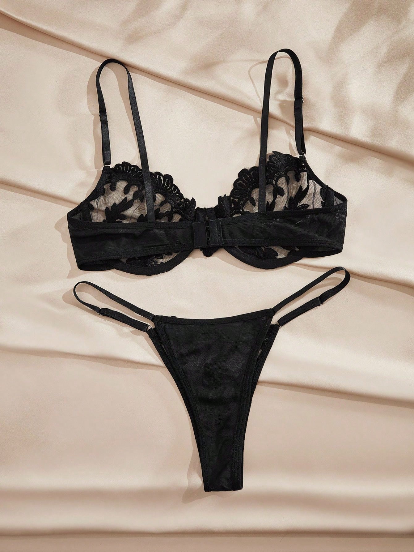 Black embroidered semi-sheer mesh underwire lingerie set with adjustable spaghetti straps and low-rise V-string panty