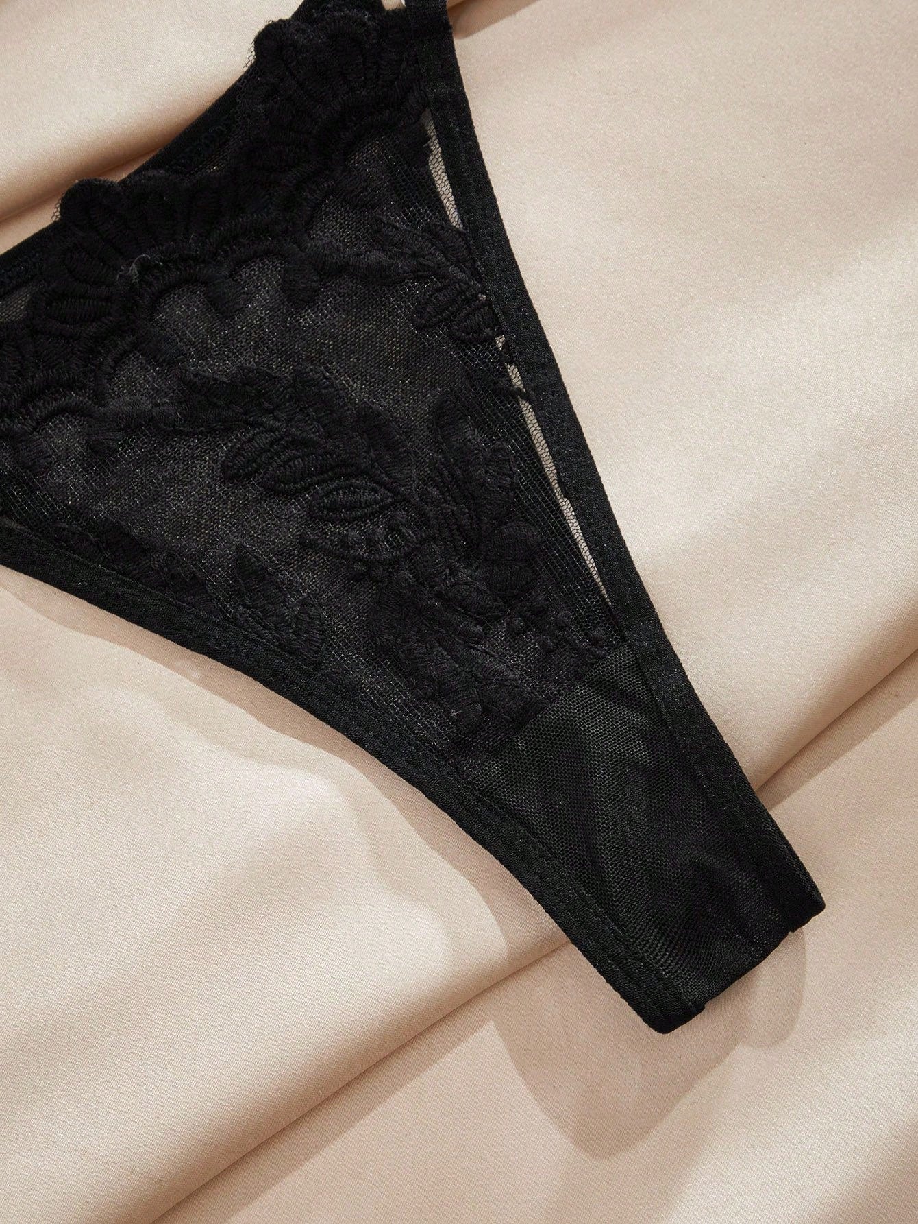 Black embroidered semi-sheer mesh underwire lingerie set with adjustable spaghetti straps and low-rise V-string panty