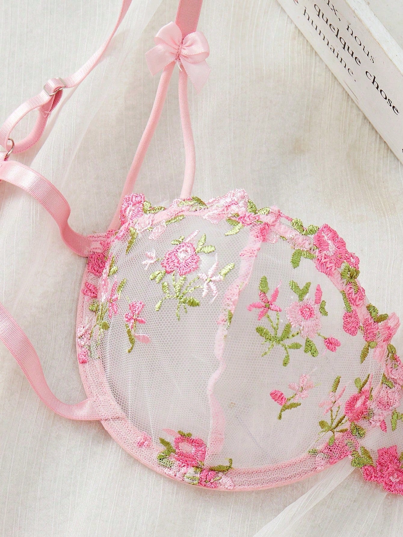 Pink women’s 2-piece lingerie set with floral embroidery and sheer mesh, featuring an underwire demi bra with adjustable spaghetti straps and a matching low-rise thong.