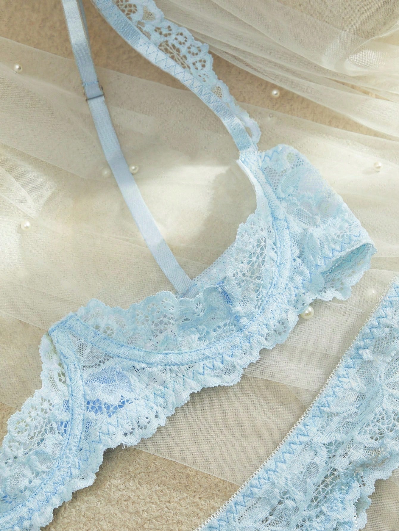 Women’s 2-piece contrast lace lingerie set with a sheer plain design, featuring an underwire open-cup bra with adjustable spaghetti straps and matching low-rise V-string panties.