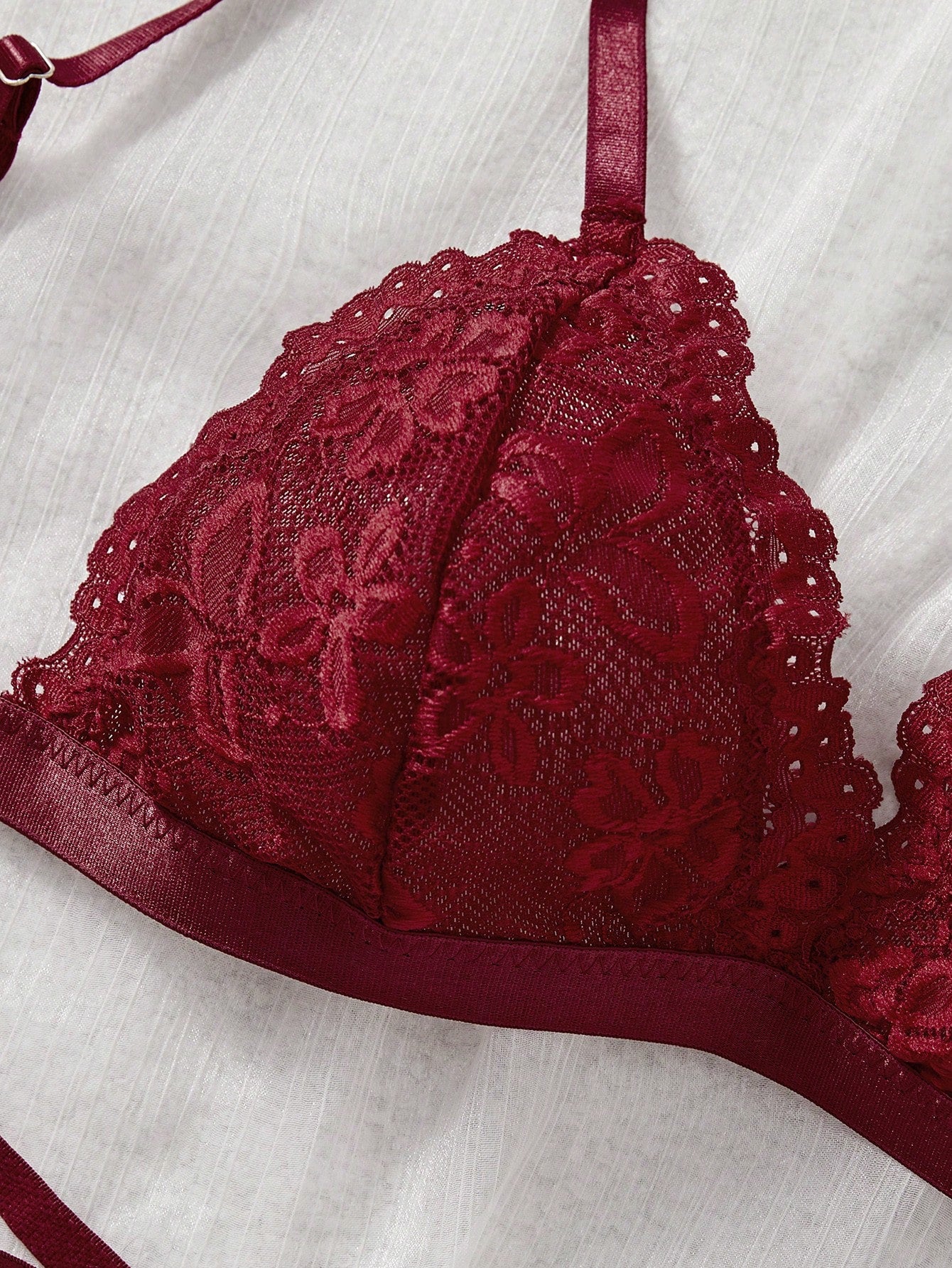 Women’s 2-piece lace patchwork solid-color lingerie set with a spaghetti-strap crossback bralette and low-rise thong panty, styled for romantic or festival looks.