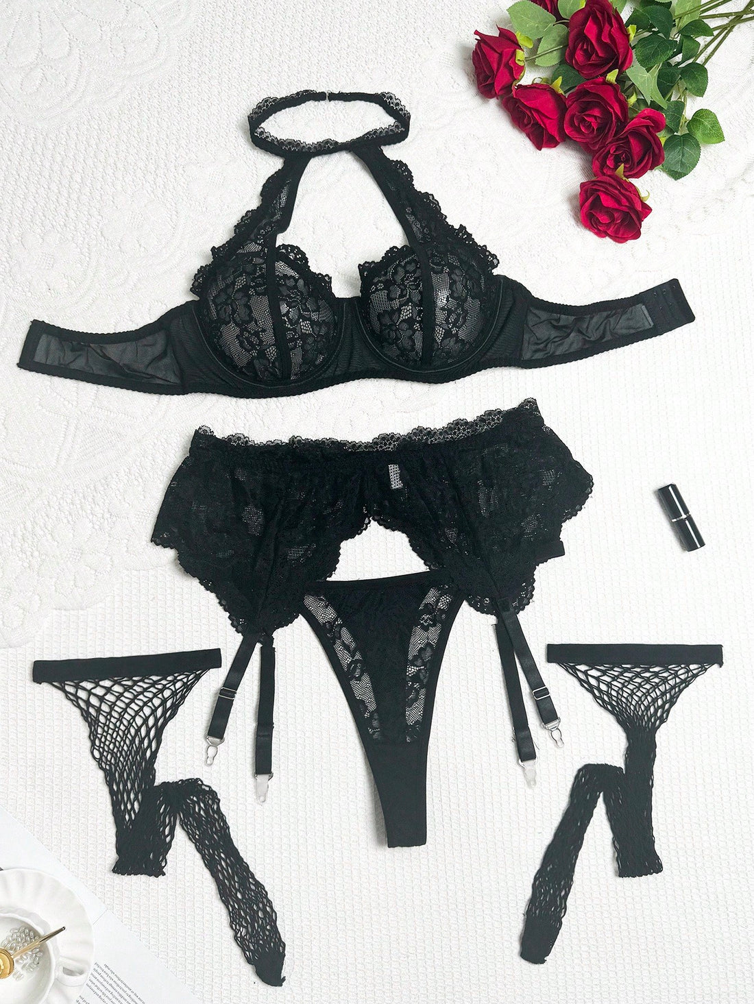 Plus size 5-piece lace lingerie set featuring a halter underwire top with adjustable straps, garter belt, thong-style G-string, and one pair of thigh-high fishnet stockings.