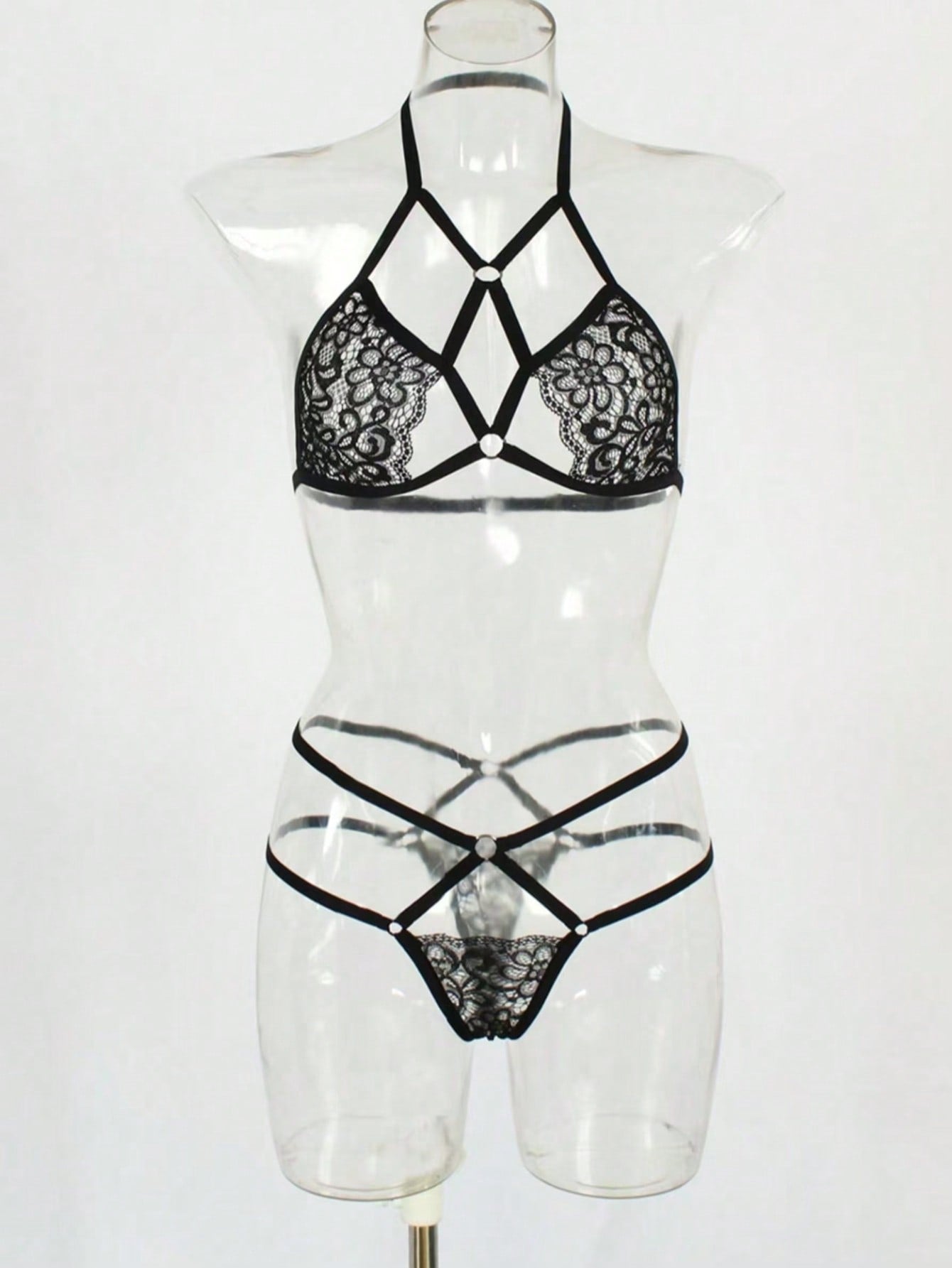 Red lace and mesh women's lingerie set with adjustable strap bralette and low-rise thong, semi-sheer plant pattern design
