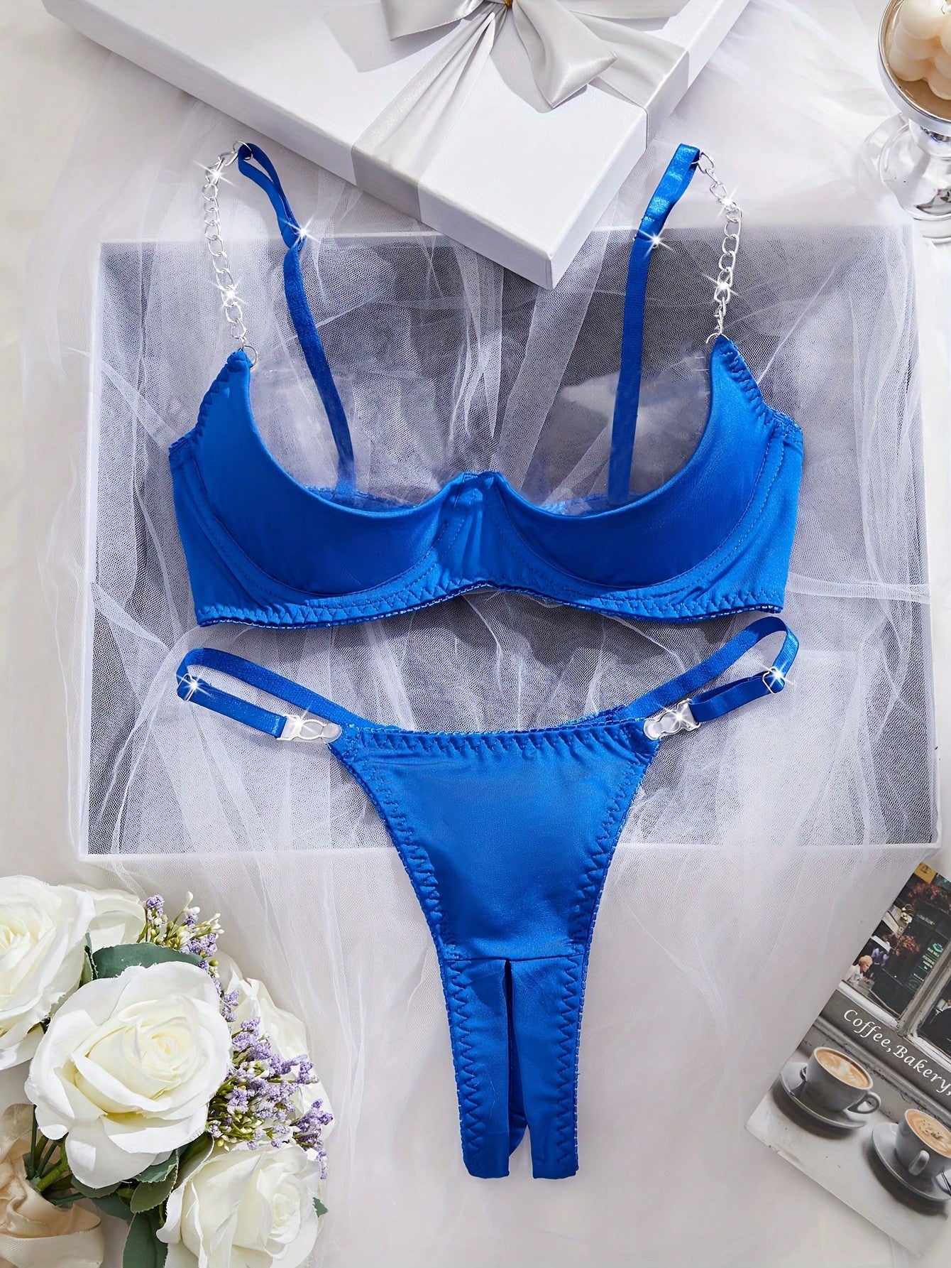 Two-piece women’s sexy lingerie set featuring an underwire lace top with adjustable shoulder straps and a matching low-rise thong, accented with a necklace detail.