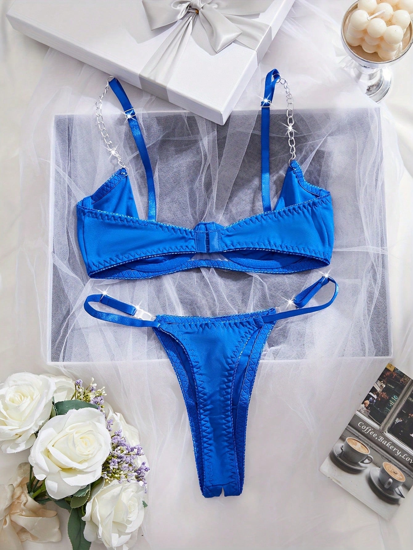 Two-piece women’s sexy lingerie set featuring an underwire lace top with adjustable shoulder straps and a matching low-rise thong, accented with a necklace detail.