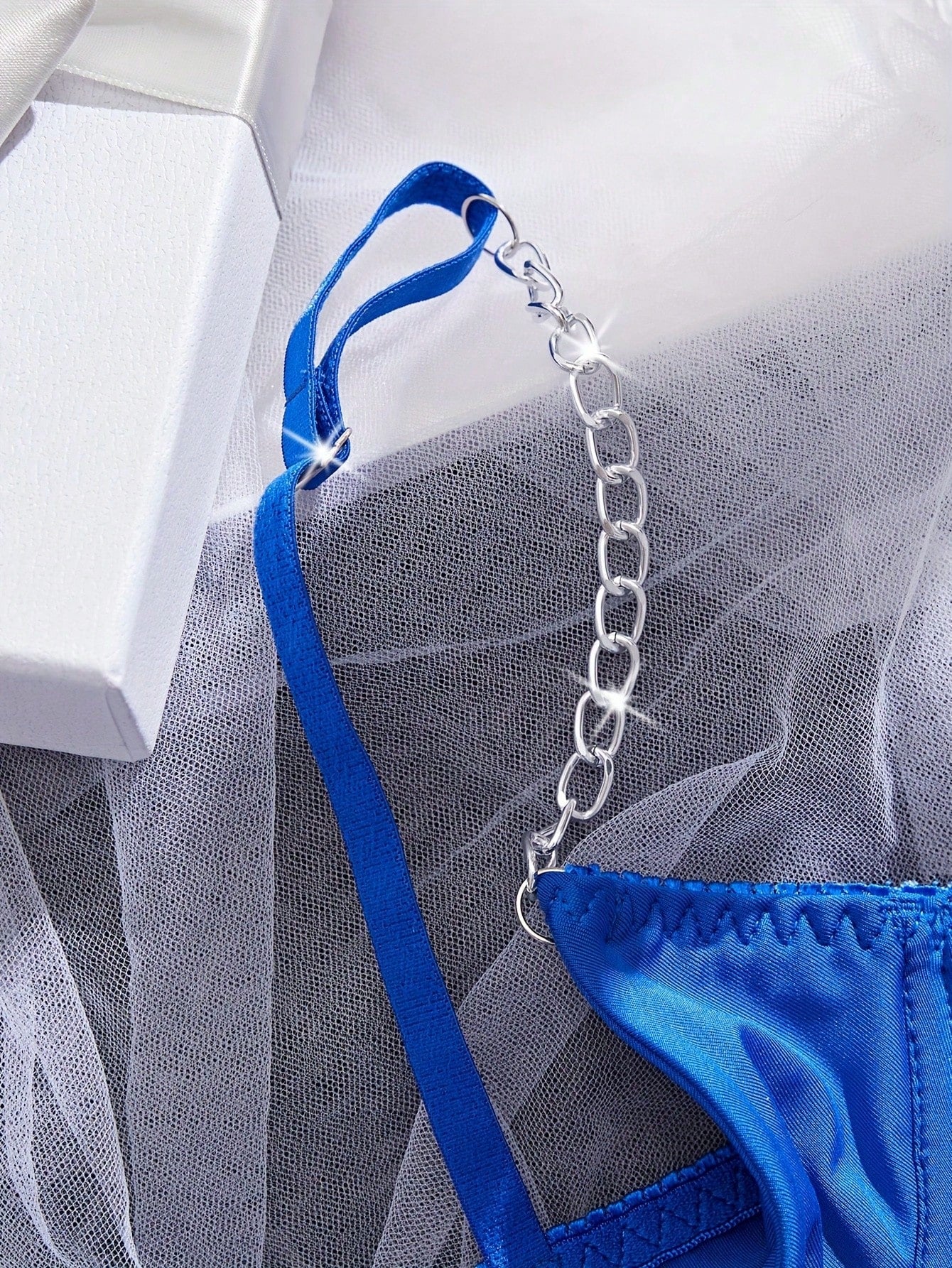 Two-piece women’s sexy lingerie set featuring an underwire lace top with adjustable shoulder straps and a matching low-rise thong, accented with a necklace detail.