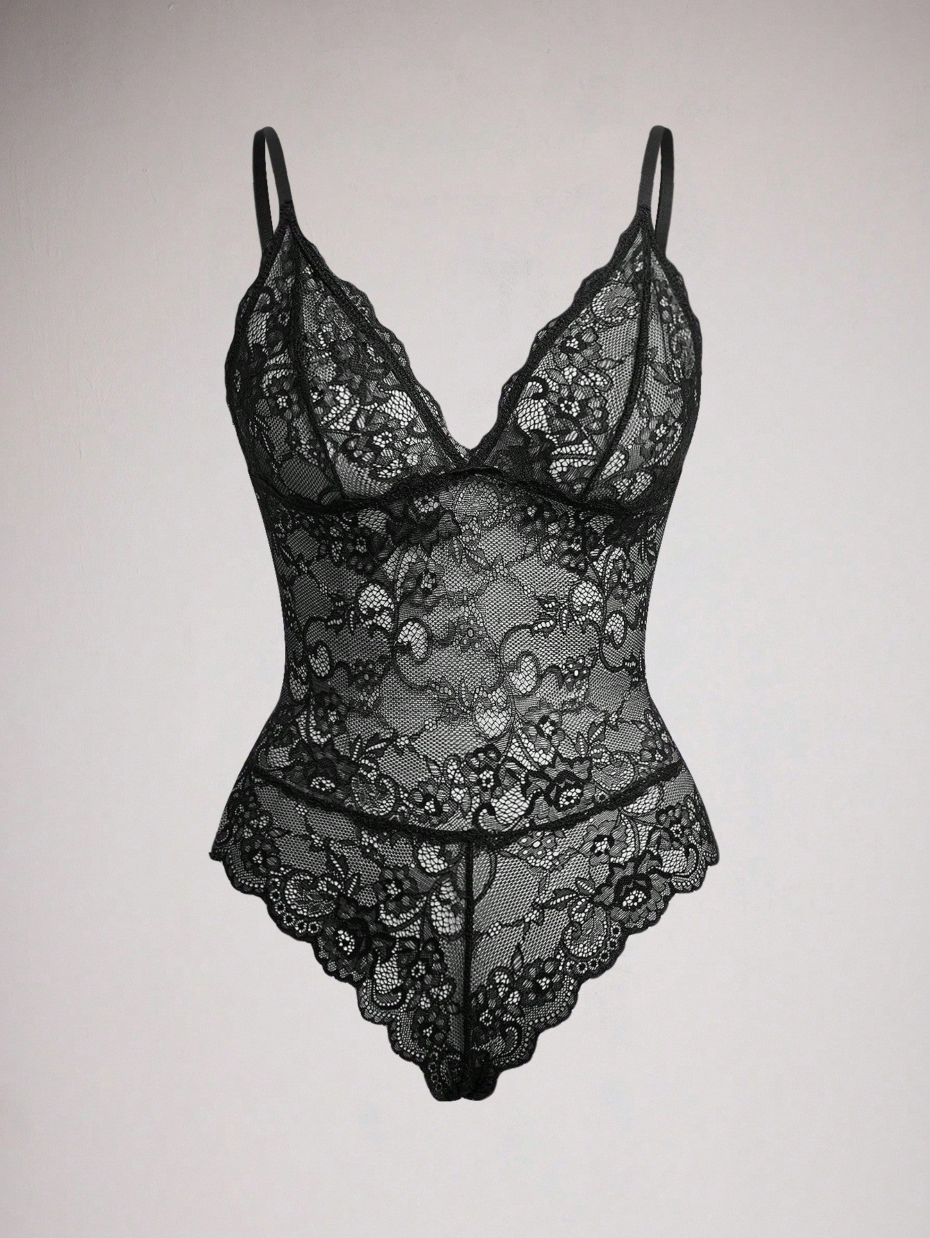 Women's black lace bodysuit with sheer contrast lace, backless design, spaghetti straps, and adjustable straps
