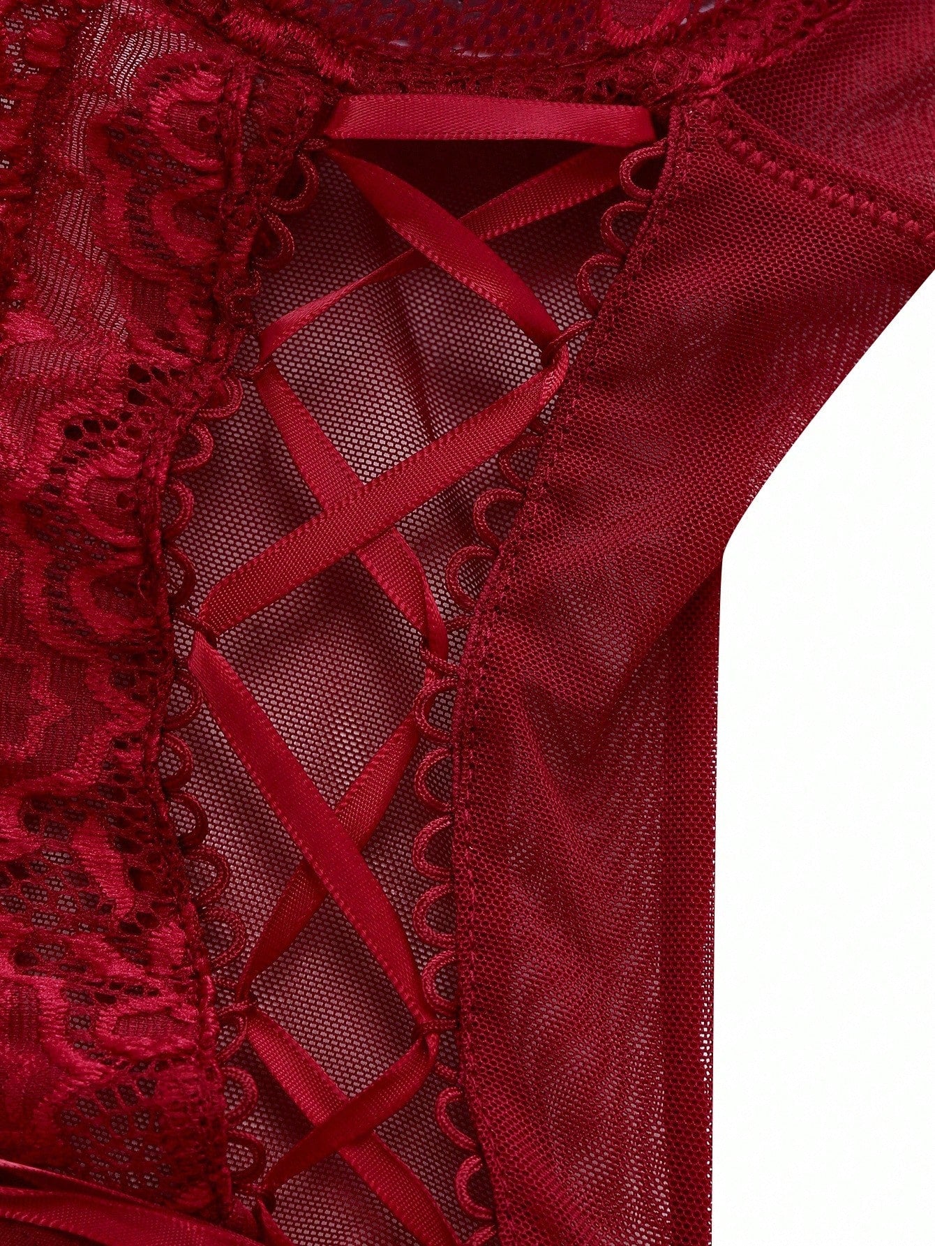 Women’s 4-piece lingerie set featuring lace and mesh panel design with tie-front detail, underwire camisole-style bra with adjustable spaghetti straps, and matching low-rise V-string panties.