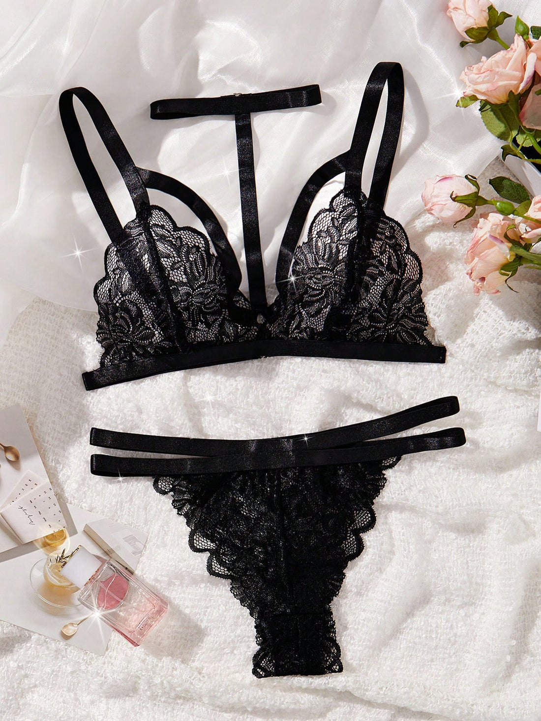 Black goth floral lace harness lingerie set featuring a bralette with cut-out details, adjustable spaghetti straps, and a cheeky mid-rise panty.