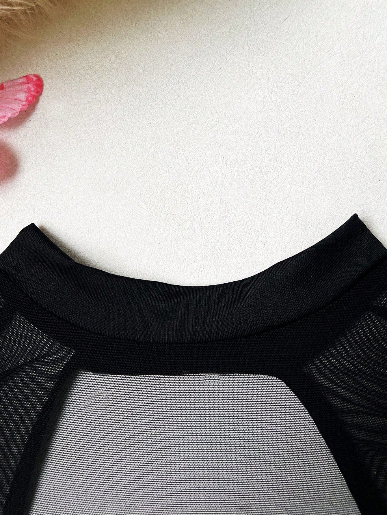 Black sheer lingerie set with a long sleeve cut-out top, thong panty, and matching stockings; includes adjustable spaghetti straps, triangle cups, underwire support, and slight stretch fabric.