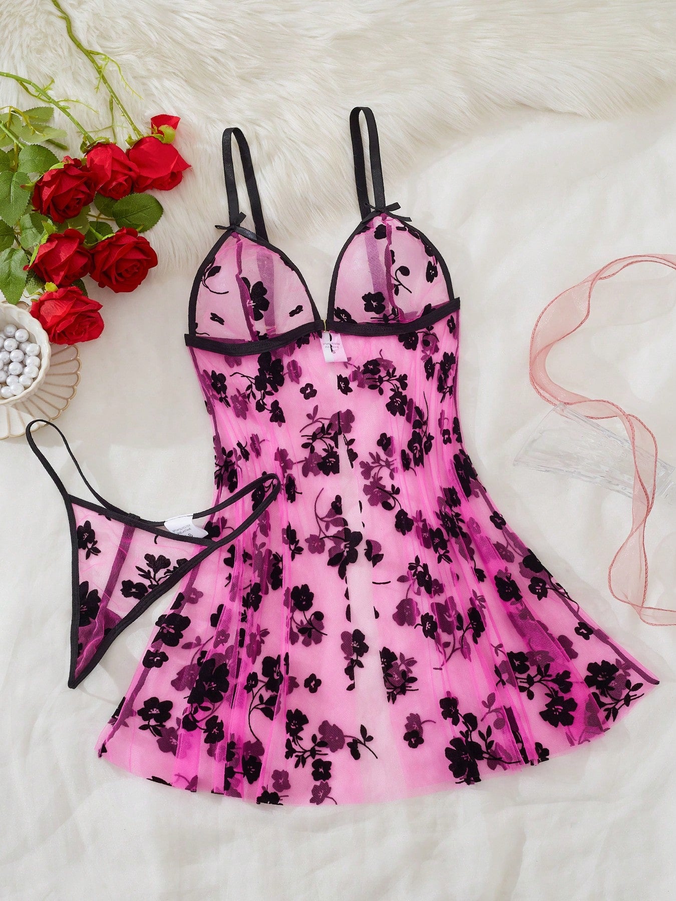 Blue 2-piece women’s lingerie set with floral print mesh and embroidery details, featuring a front-closure spaghetti strap babydoll with adjustable straps and a matching low-rise thong; semi-sheer, sleeveless, and wireless design.