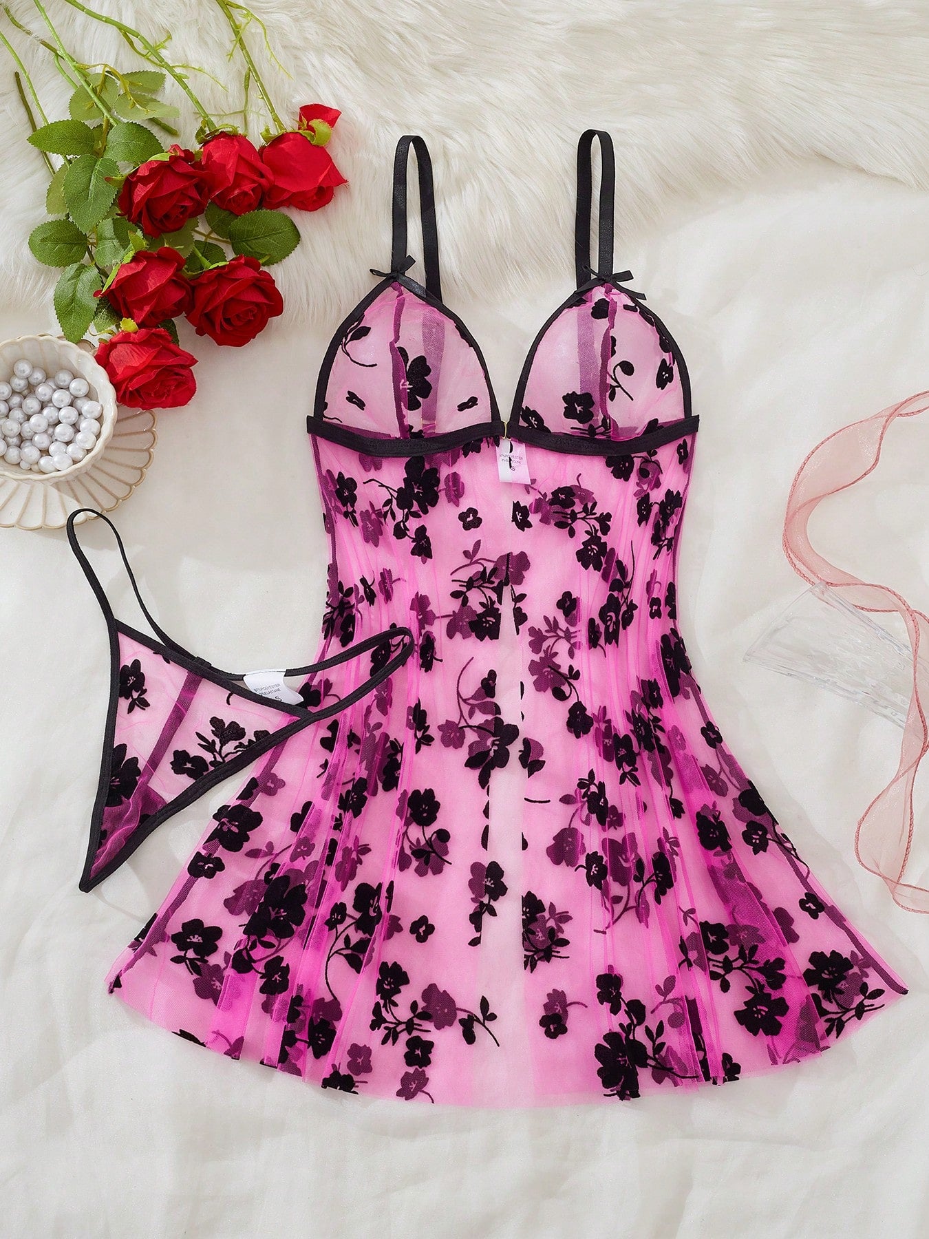 Blue 2-piece women’s lingerie set with floral print mesh and embroidery details, featuring a front-closure spaghetti strap babydoll with adjustable straps and a matching low-rise thong; semi-sheer, sleeveless, and wireless design.