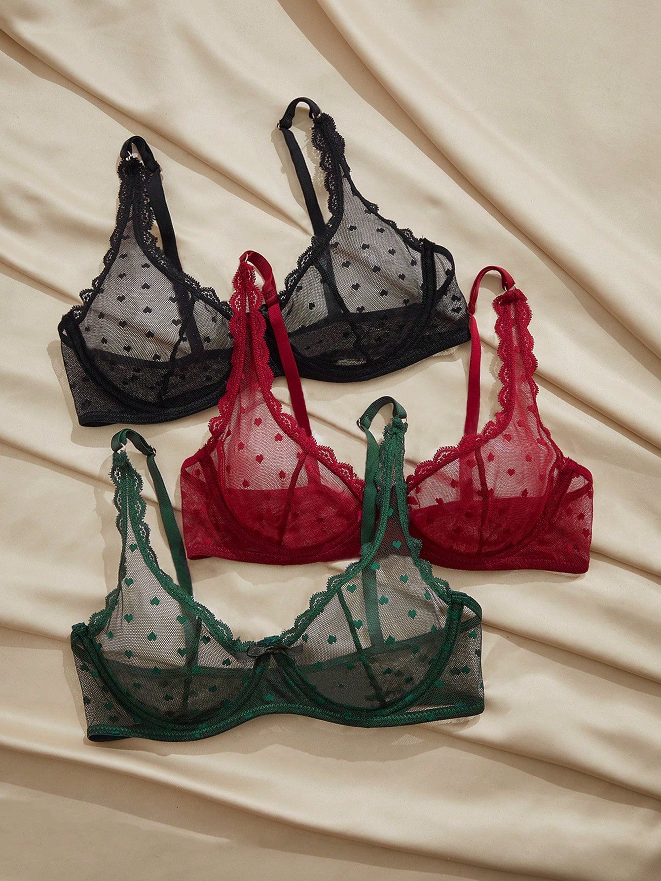 Women's solid color lace bra with sheer unlined design, bow detail, underwire support, and adjustable straps; romantic style push-up bralette for daily wear.