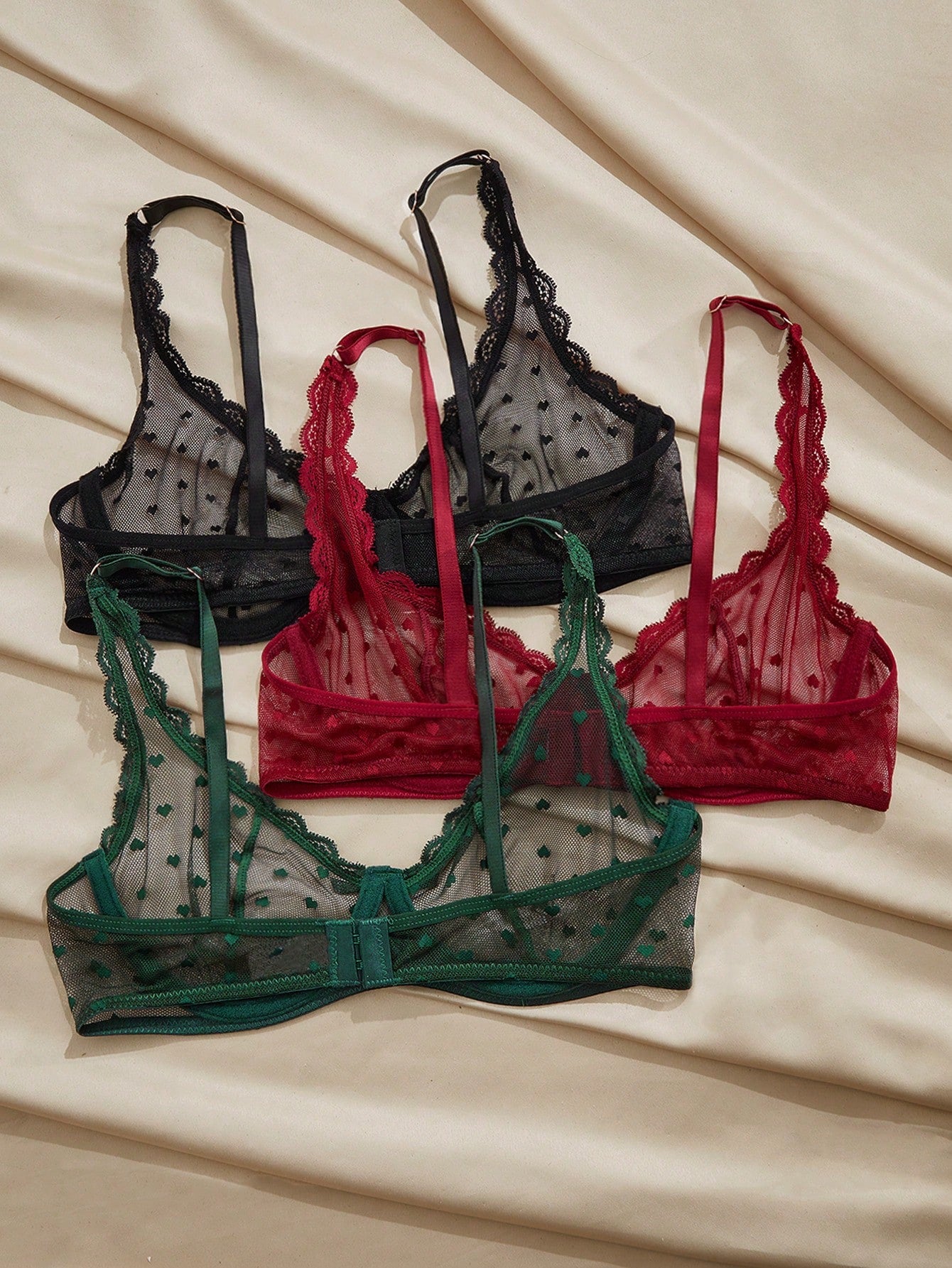 Women's solid color lace bra with sheer unlined design, bow detail, underwire support, and adjustable straps; romantic style push-up bralette for daily wear.