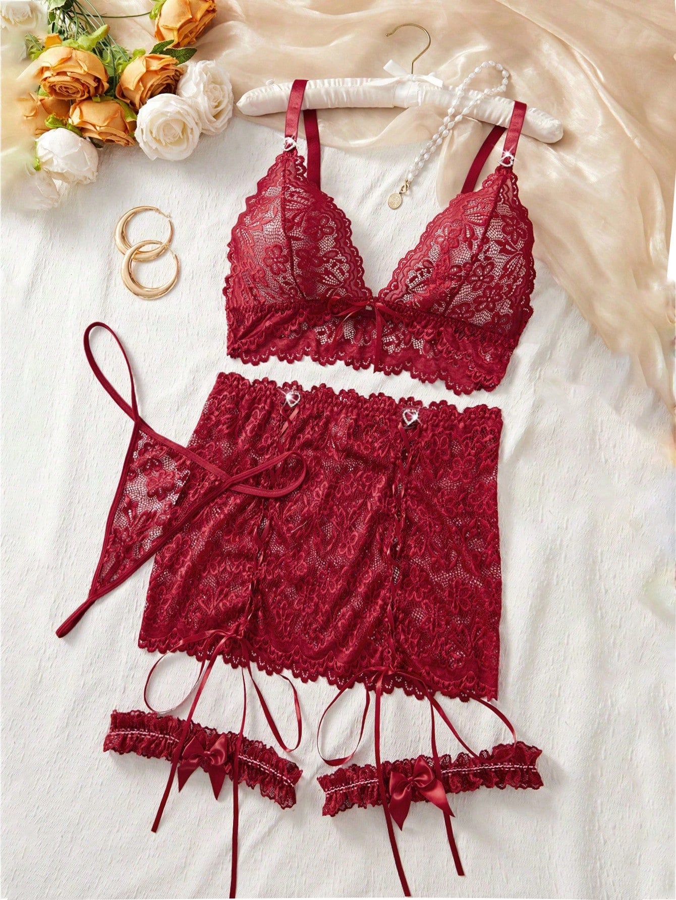 Women’s sheer lingerie set featuring a lace-up bralette with adjustable spaghetti straps, matching high-rise thong, and short lace skirt with drawstring details; wireless design with slight stretch in a 5-piece set.