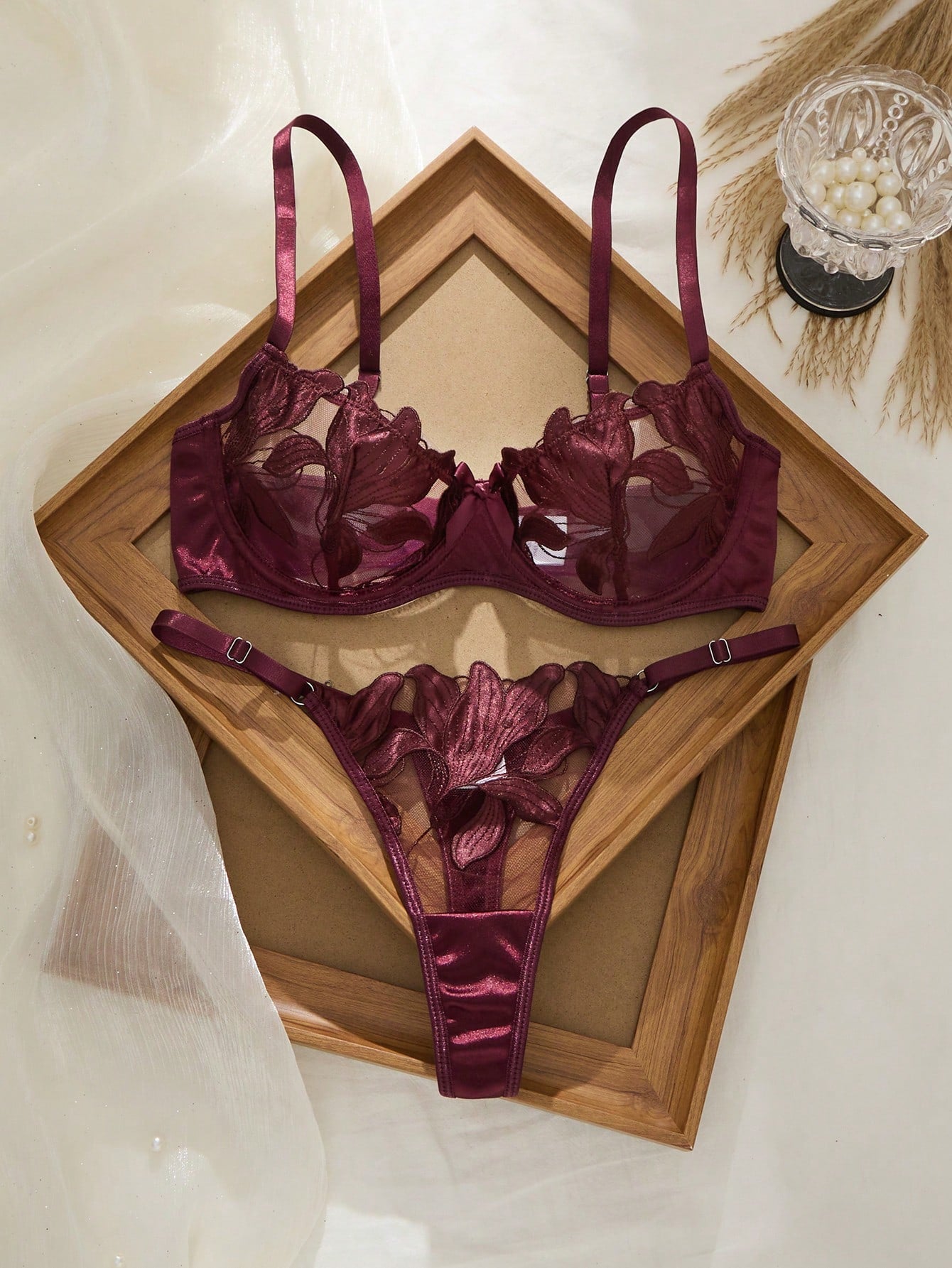 Women’s 2-piece sexy lingerie set featuring an embroidered sheer mesh demi bra with adjustable spaghetti straps and a matching low-rise thong.