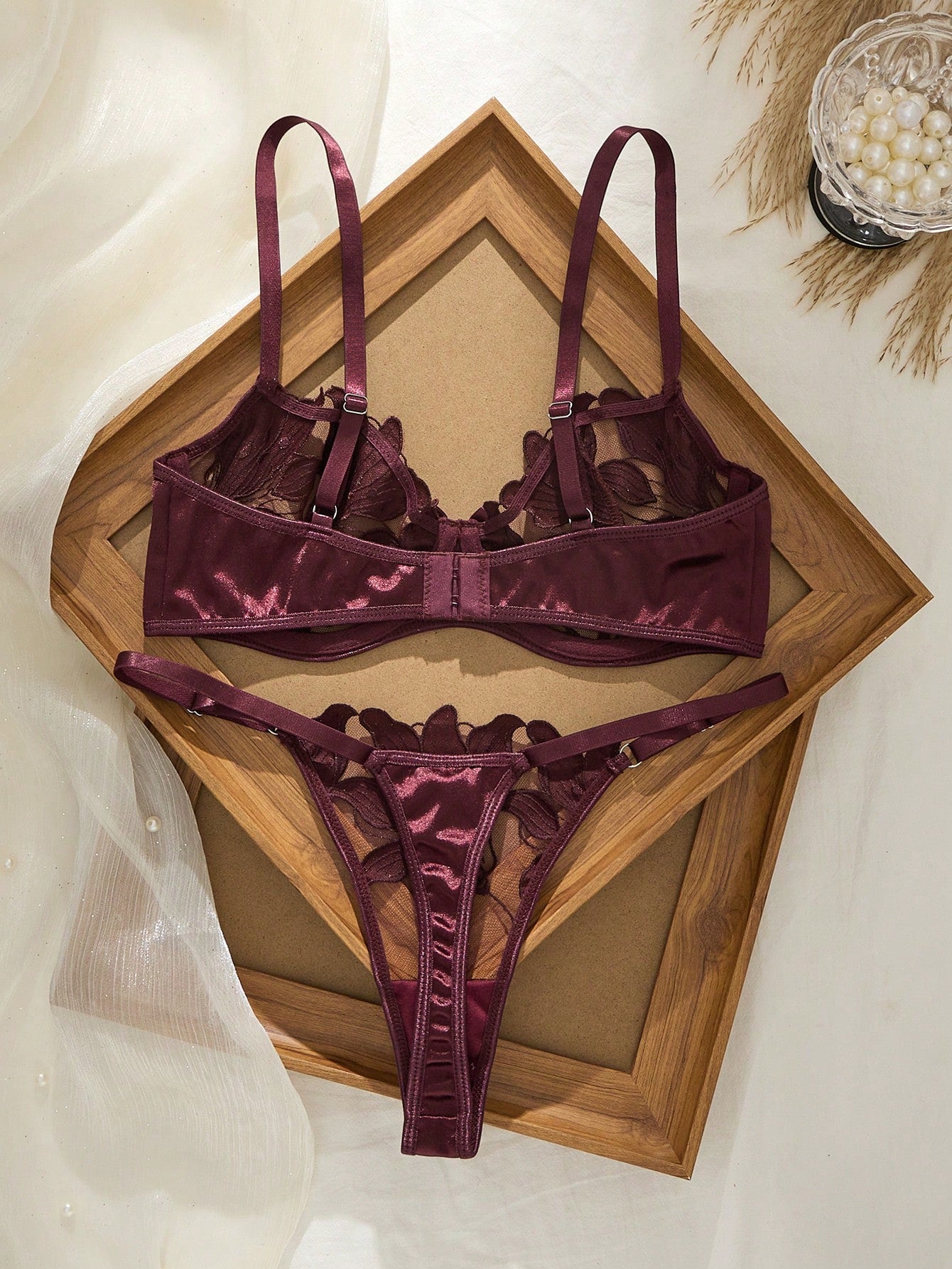 Women’s 2-piece sexy lingerie set featuring an embroidered sheer mesh demi bra with adjustable spaghetti straps and a matching low-rise thong.
