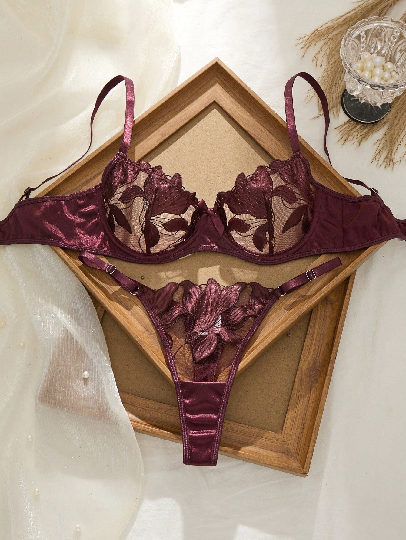 Women’s 2-piece sexy lingerie set featuring an embroidered sheer mesh demi bra with adjustable spaghetti straps and a matching low-rise thong.