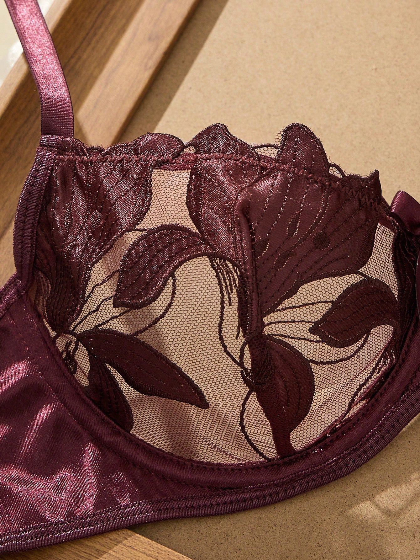 Women’s 2-piece sexy lingerie set featuring an embroidered sheer mesh demi bra with adjustable spaghetti straps and a matching low-rise thong.