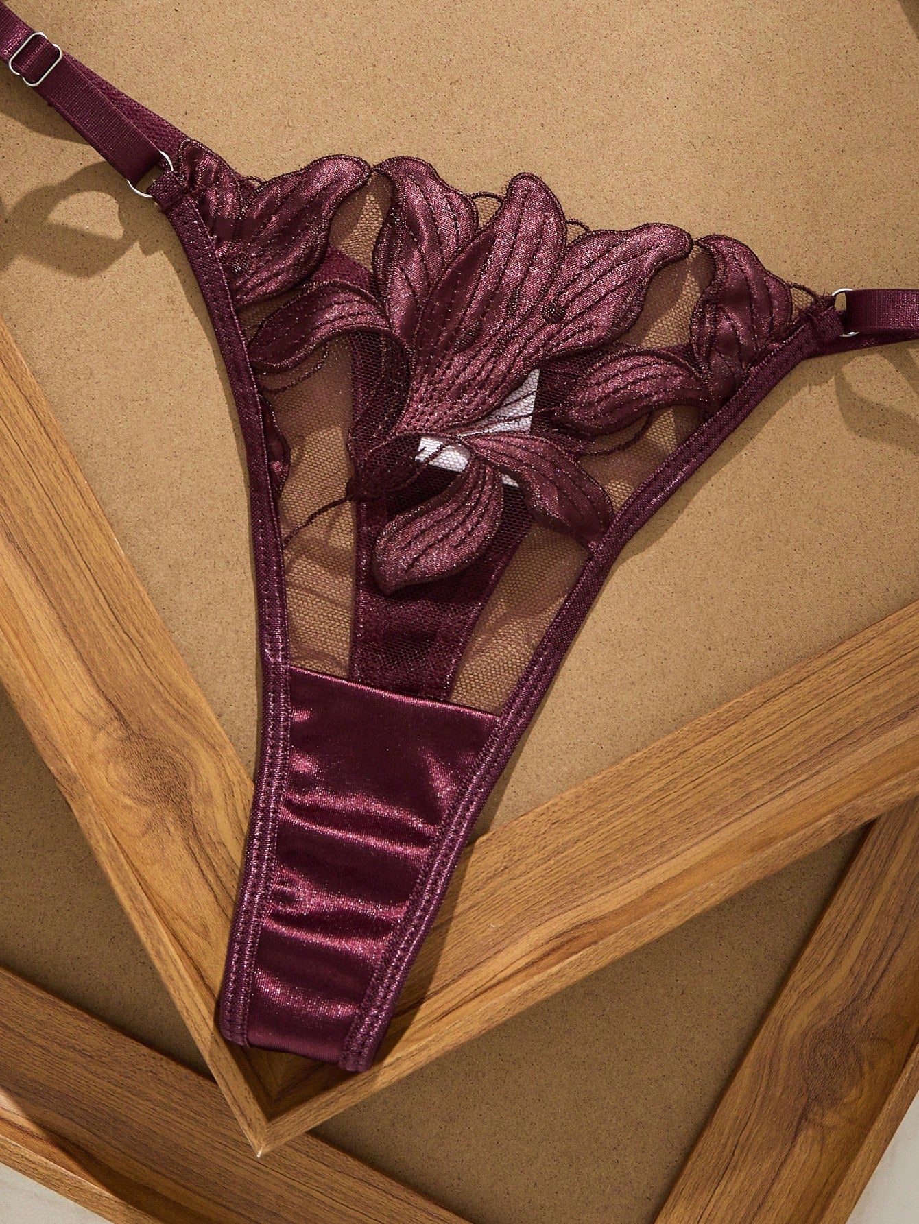 Women’s 2-piece sexy lingerie set featuring an embroidered sheer mesh demi bra with adjustable spaghetti straps and a matching low-rise thong.