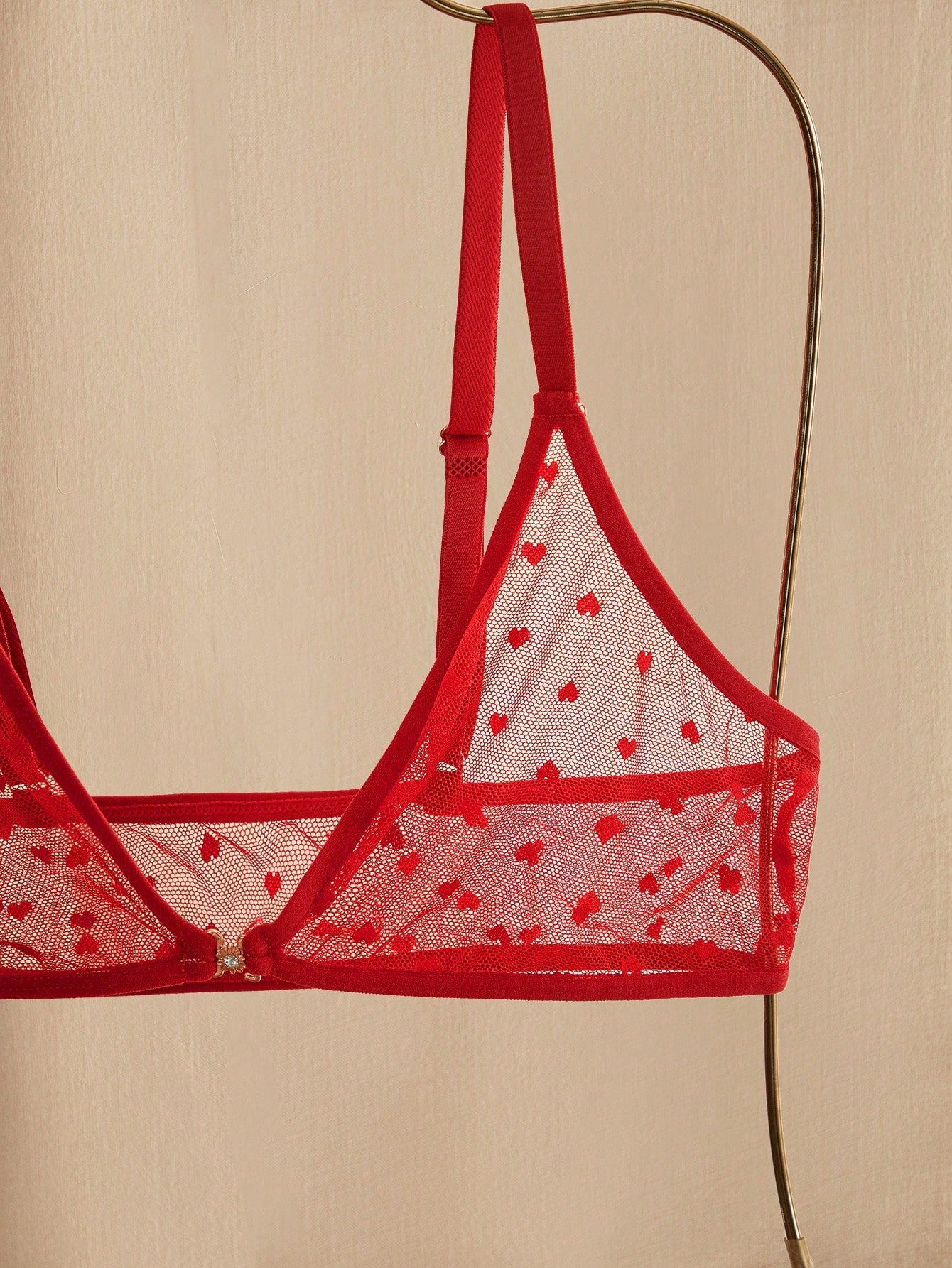 Women’s 2-piece lingerie set with a polka dot mesh bralette featuring a front closure, adjustable straps, lace trim, and a matching low-rise thong.